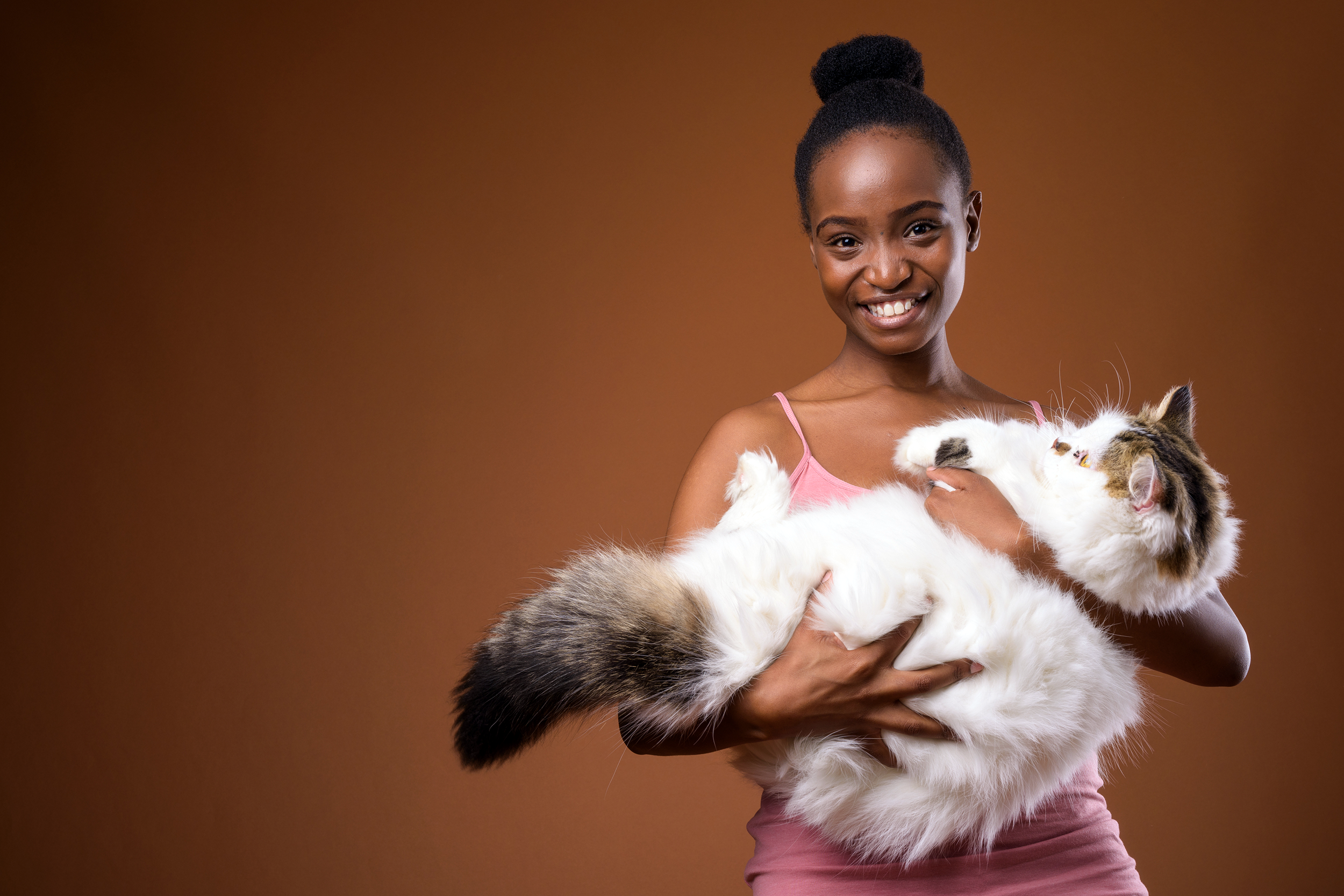 Woman holding her fluffy cat