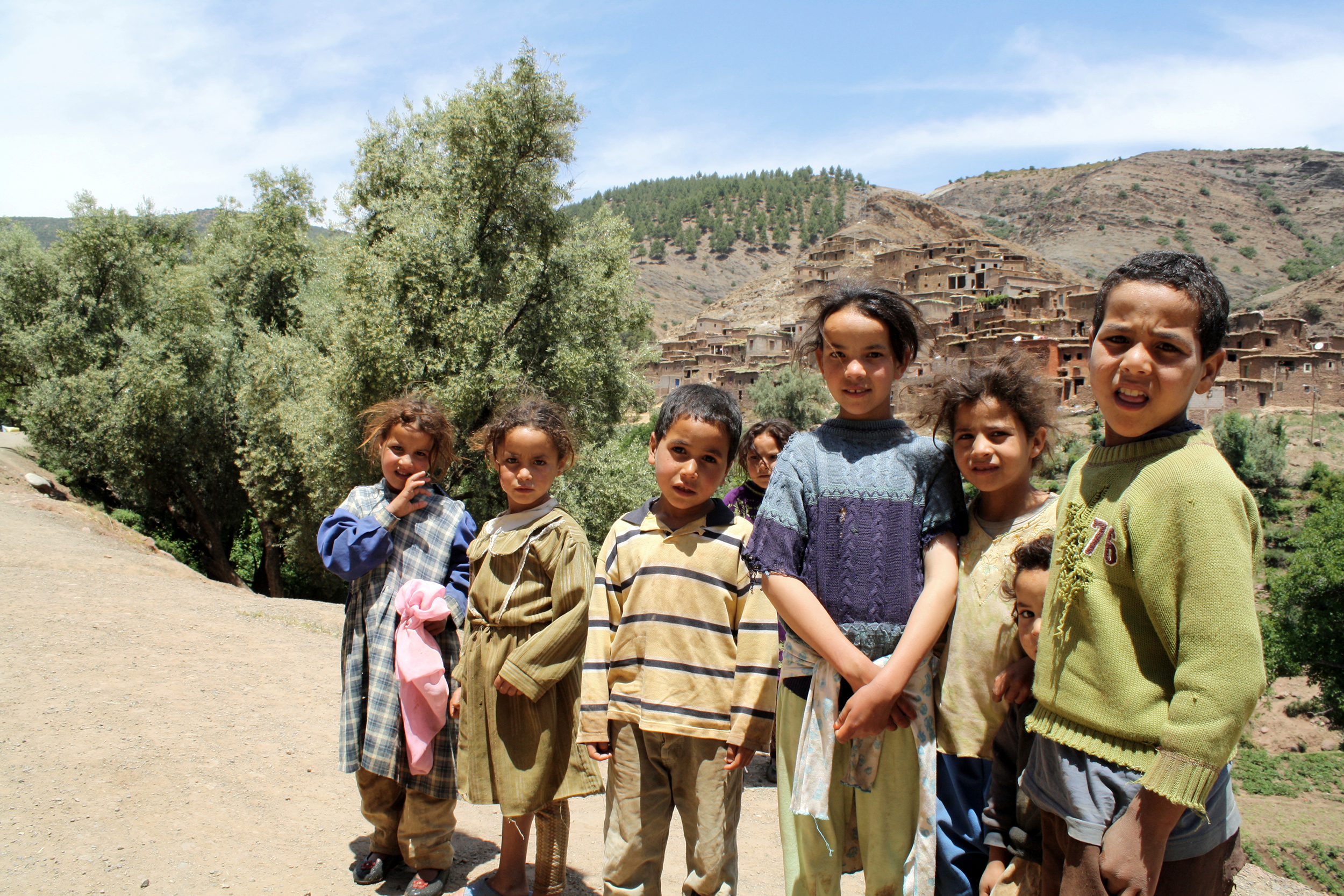 Children standing on the side of the road in Morocco