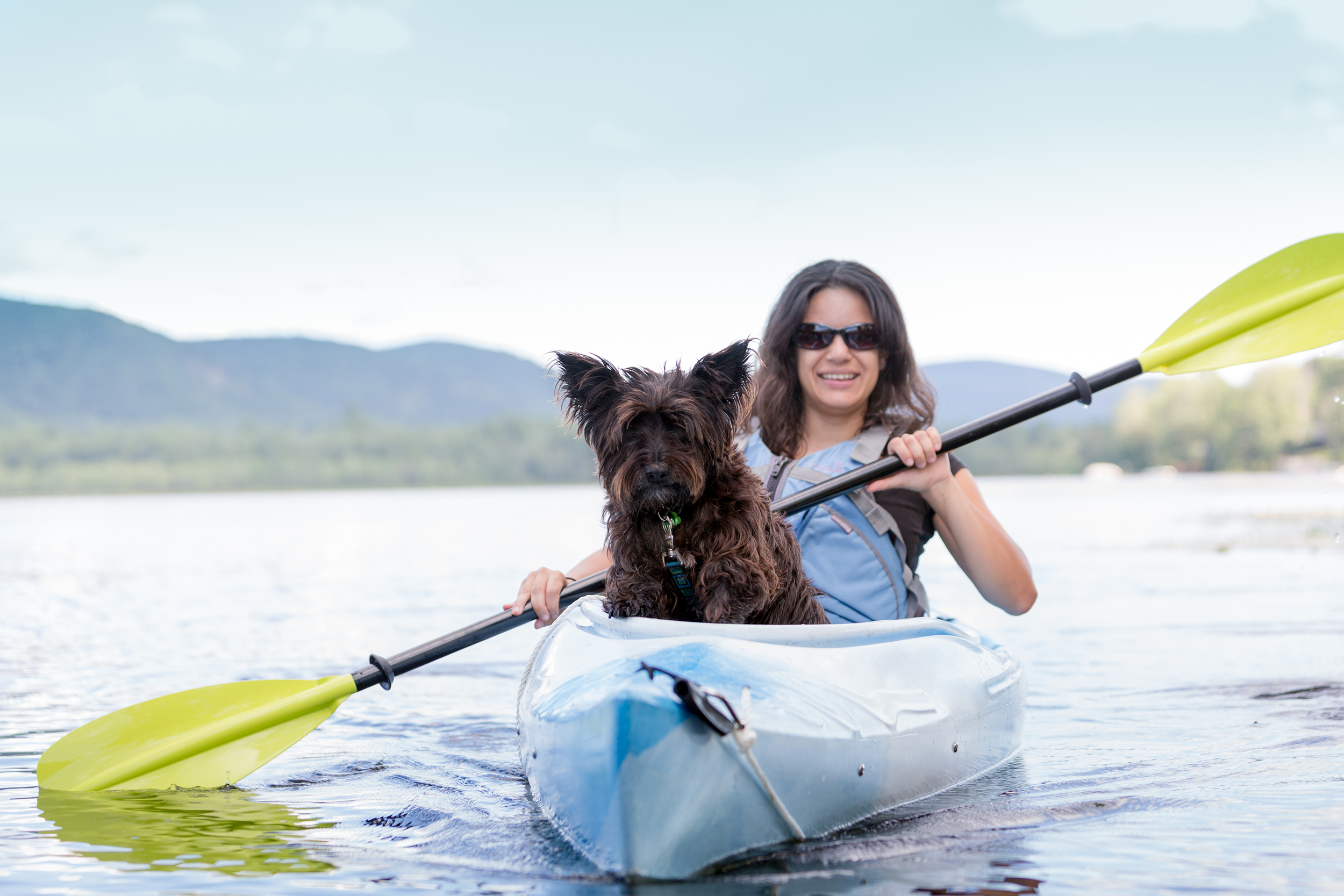 Woman kayaking with her dog