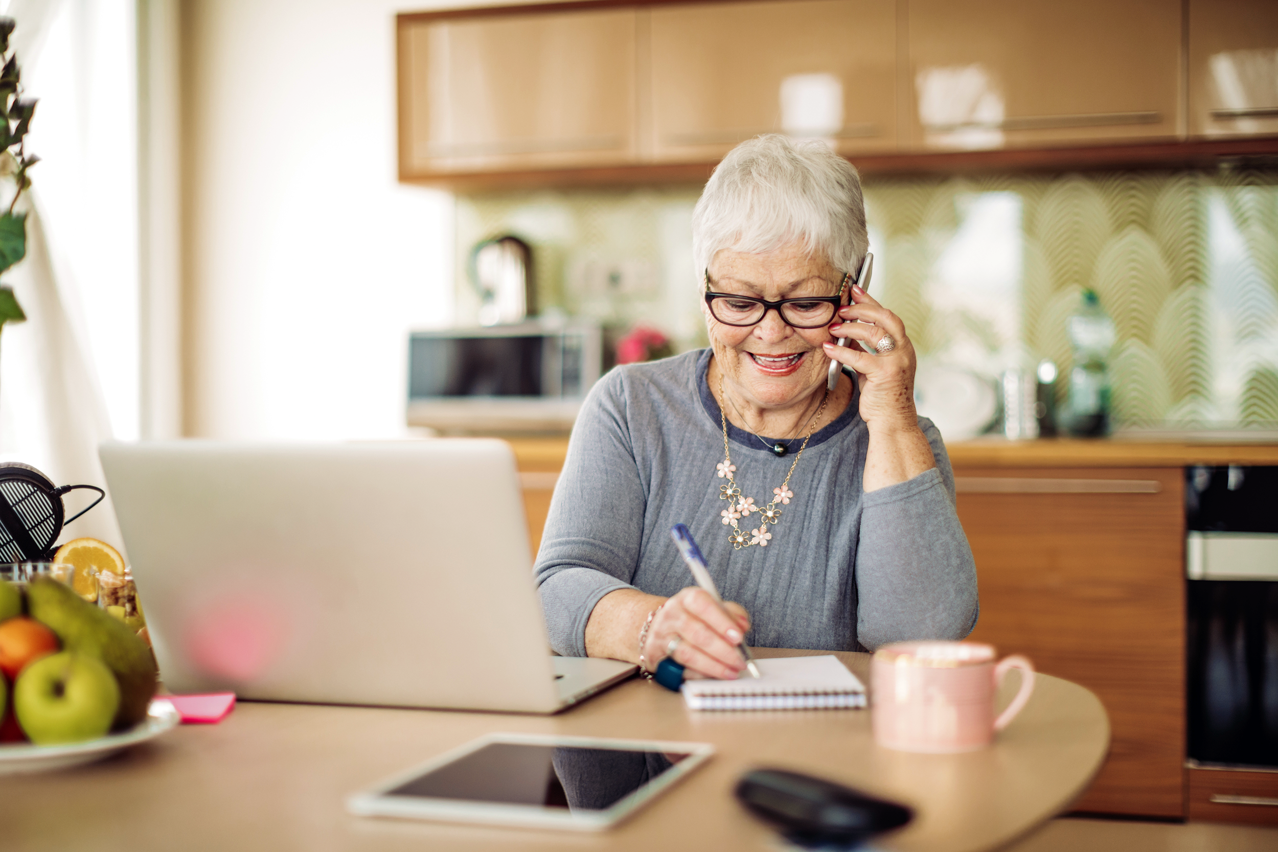 Senior woman working from home