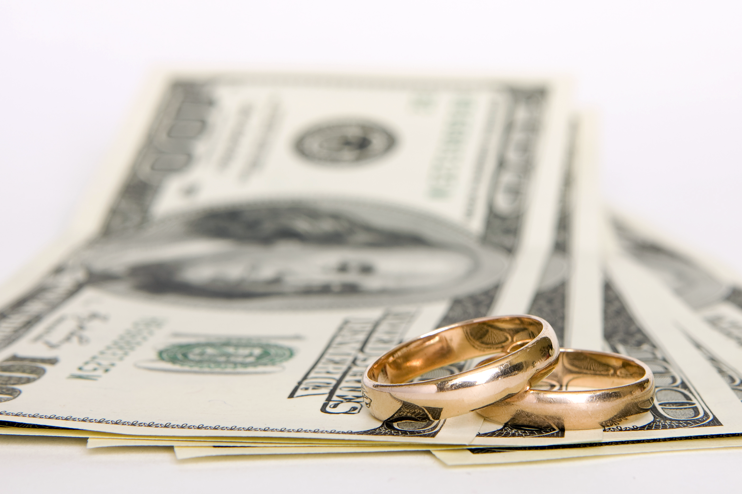Wedding rings on top of money