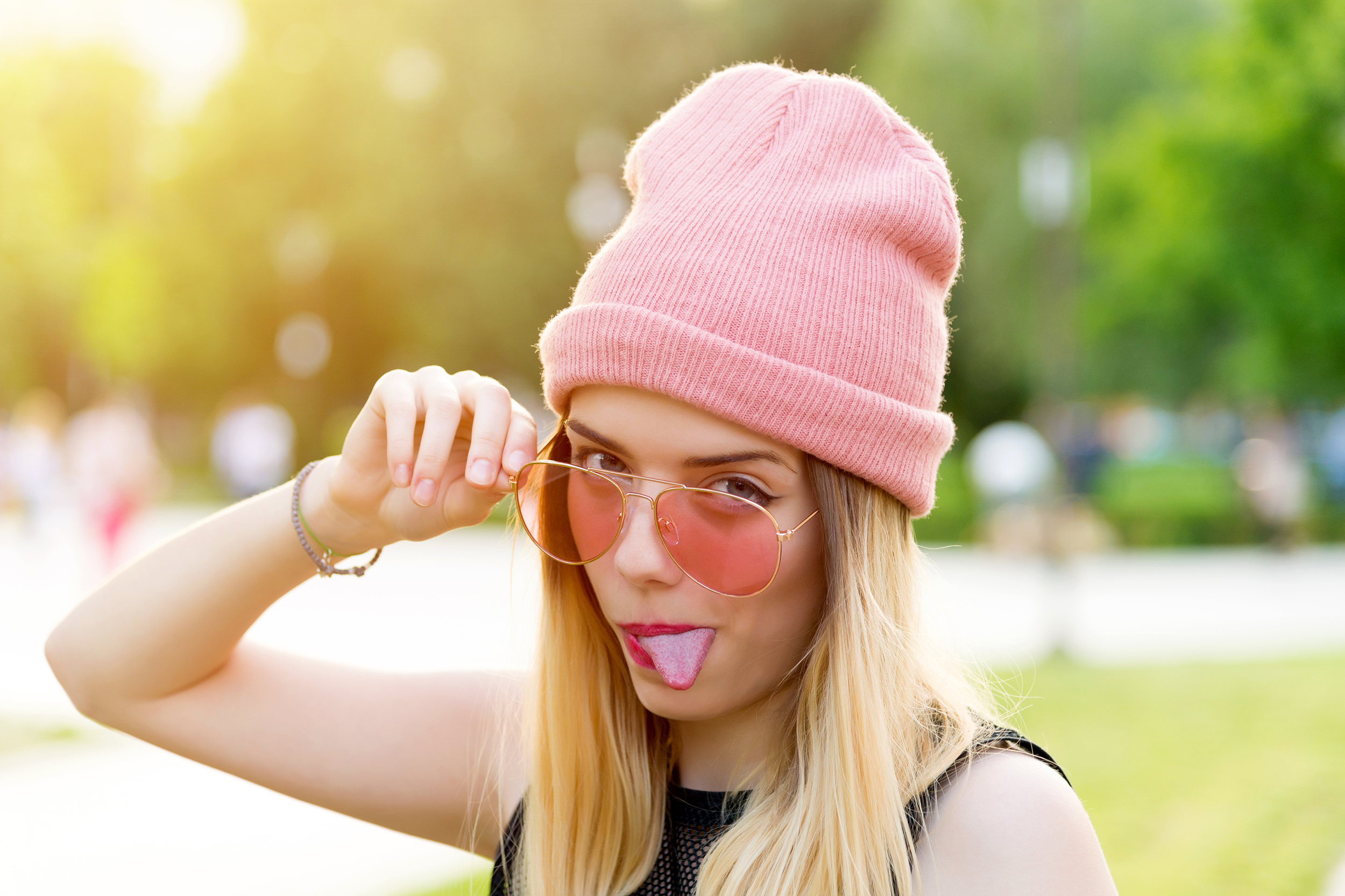 Hipster teen sticking her tongue out