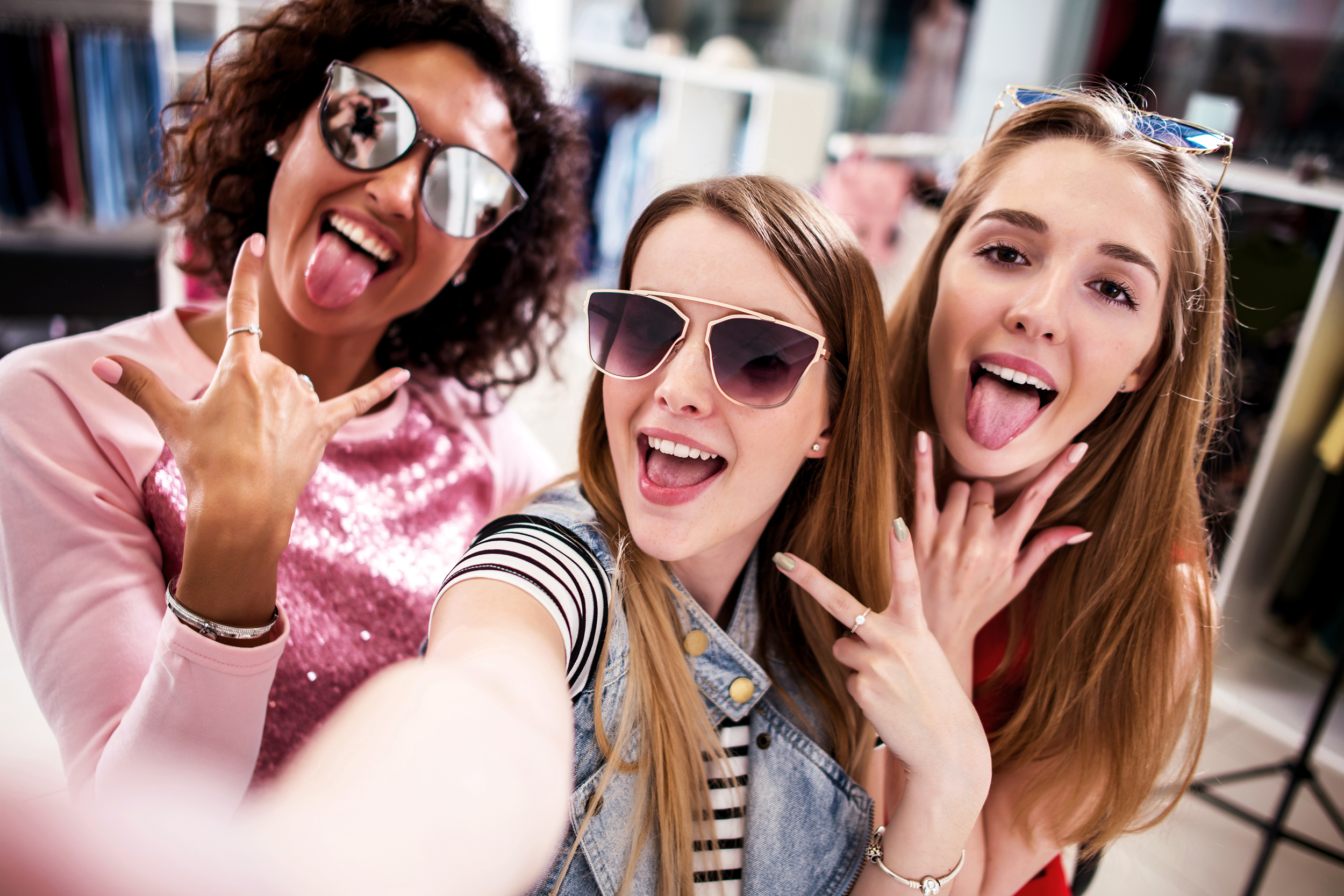 Group of teenage girls having fun at the mall
