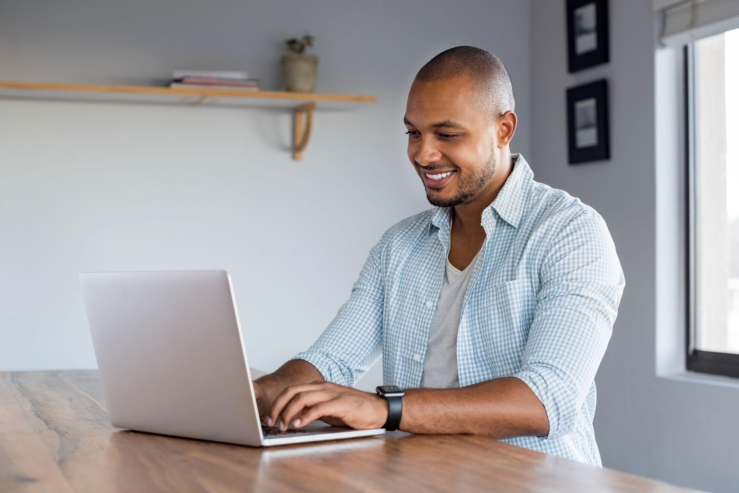 Man working on his laptop at home