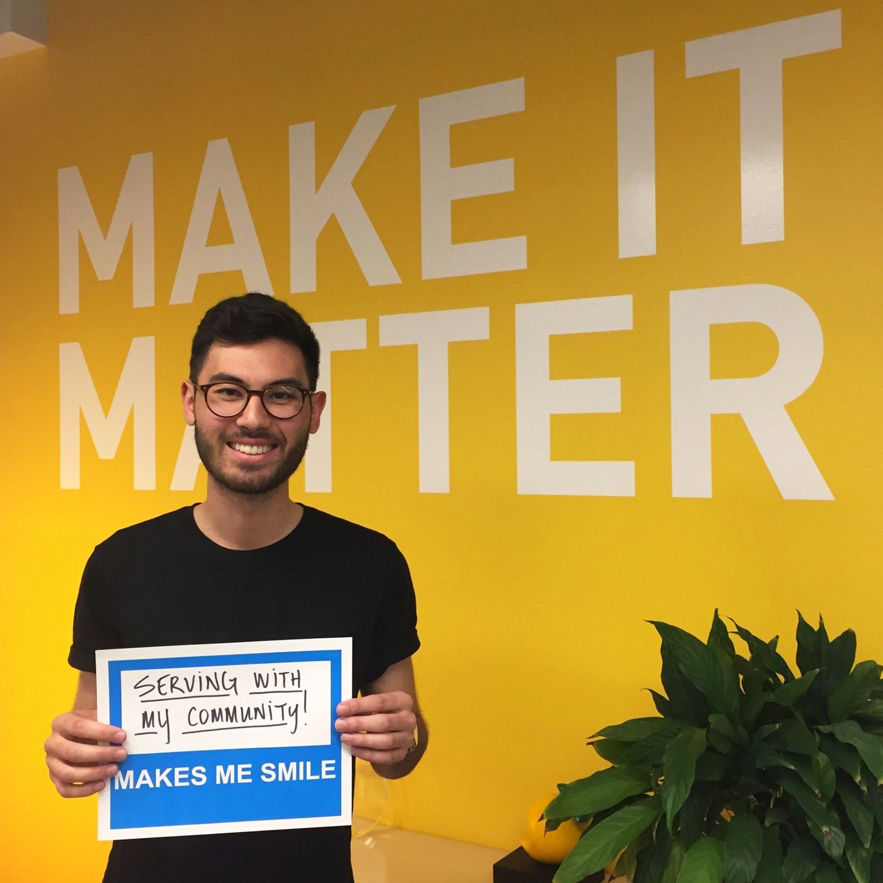 Taproot Foundation employee holding a sign