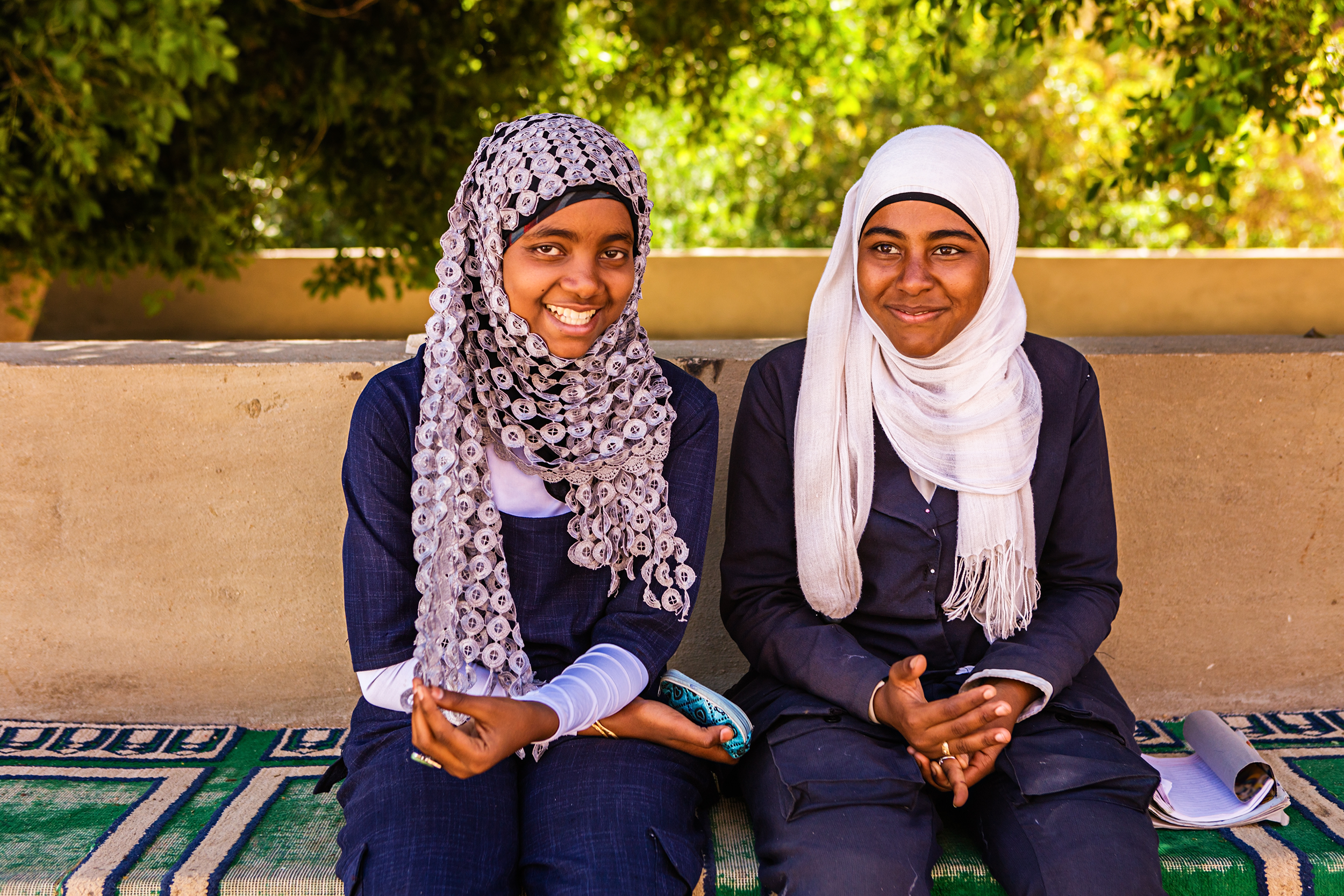 Muslim women sitting on a bench in Sudan