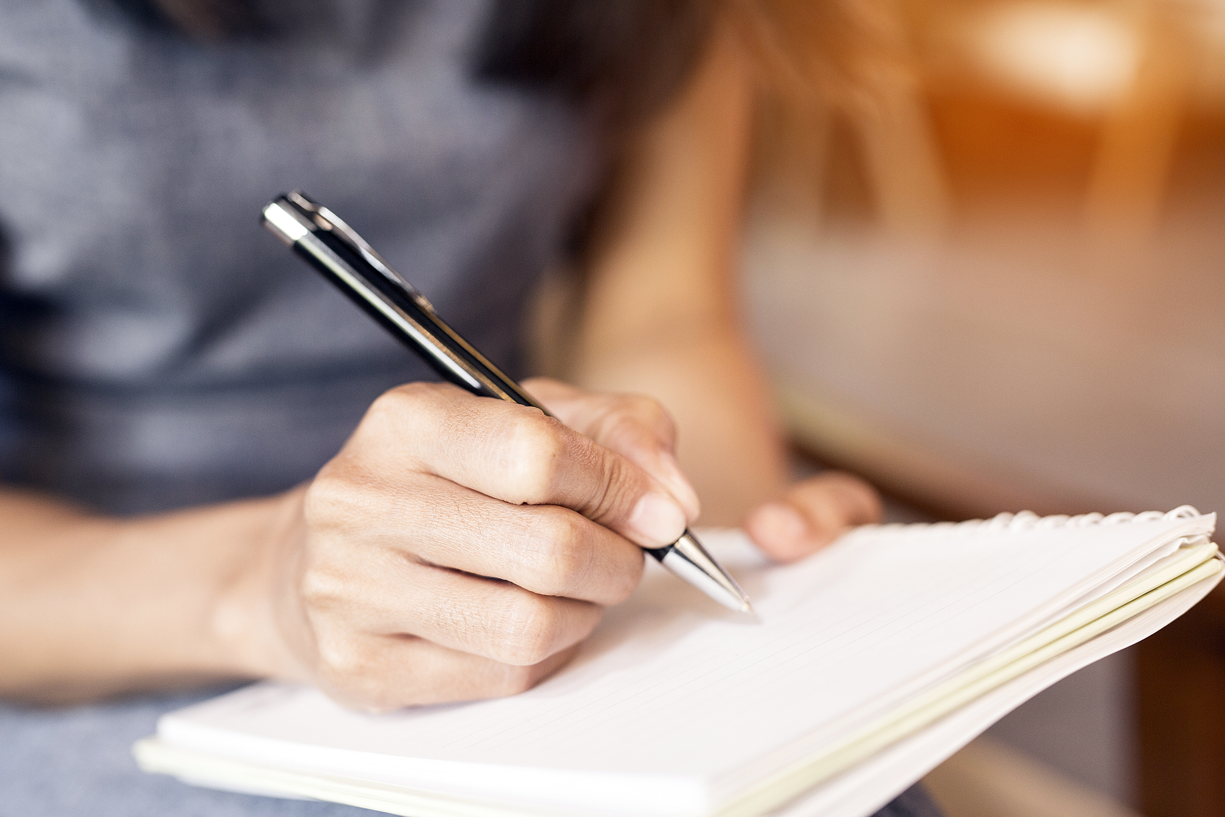 Writing in a notebook