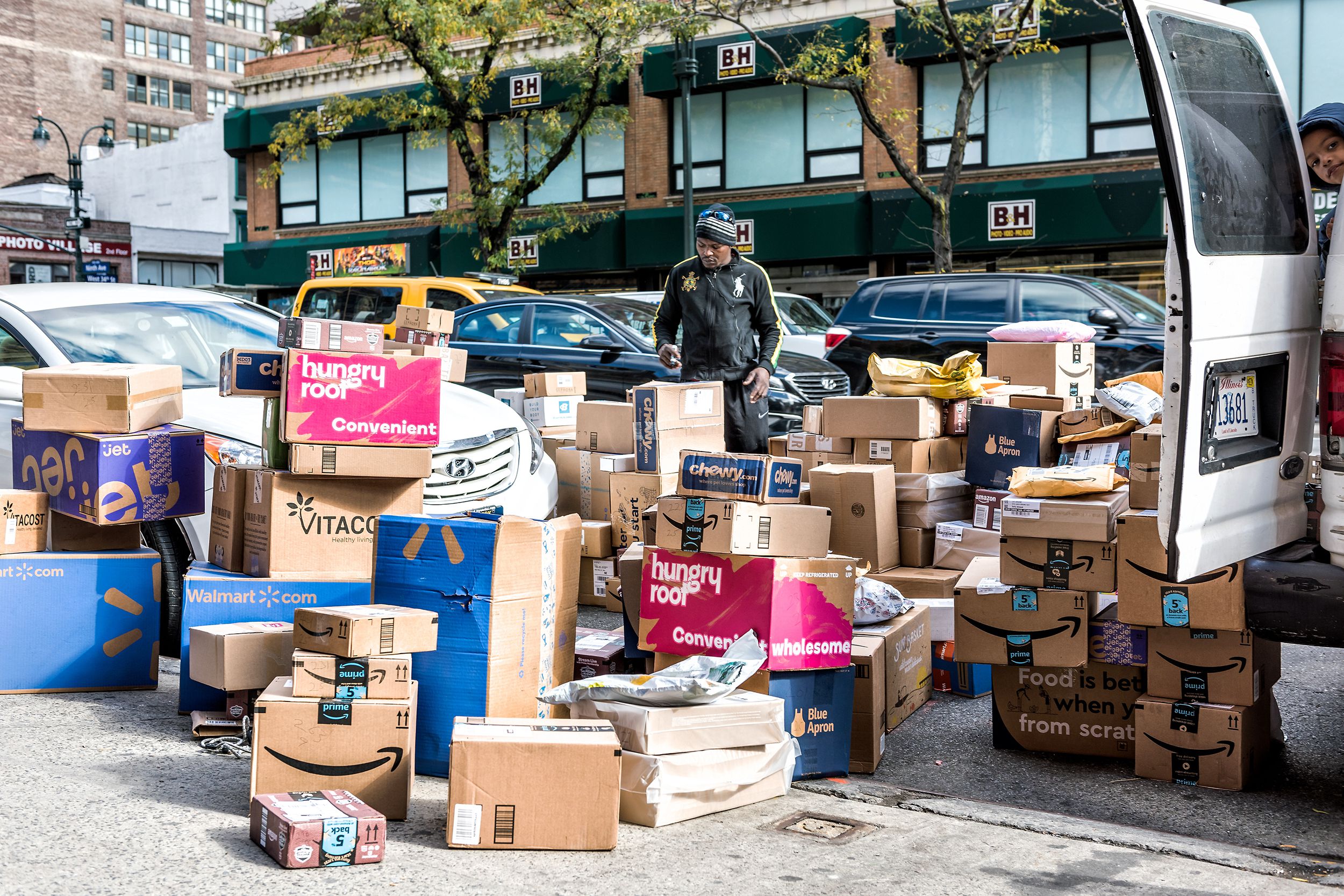 delivery man with many boxes in New York City