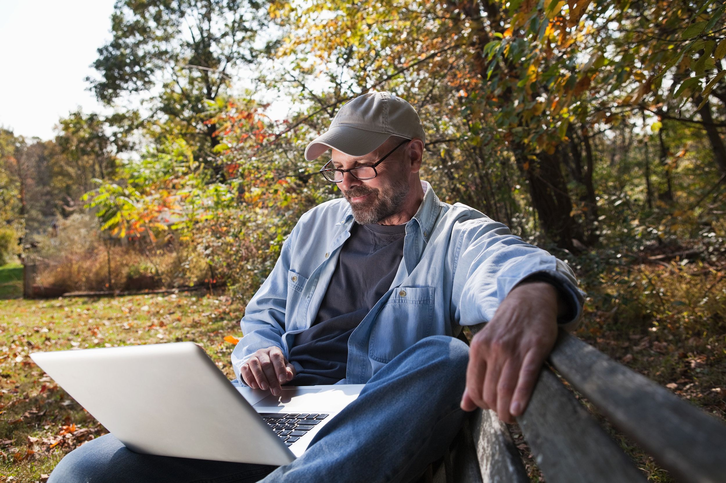 mature man using laptop outdoors in Bucks County, Pennsylvania