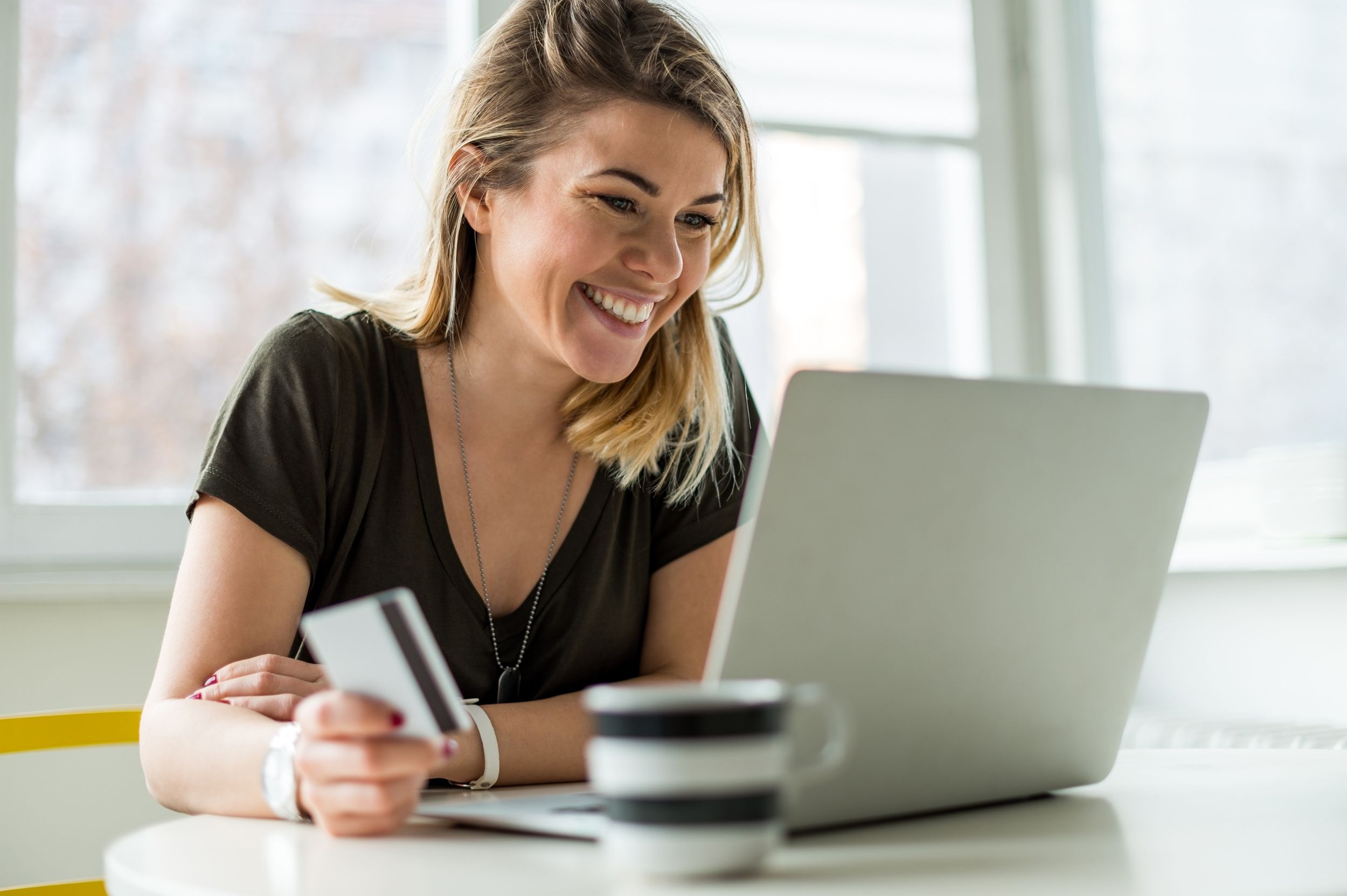 woman internet shopping at a cafe