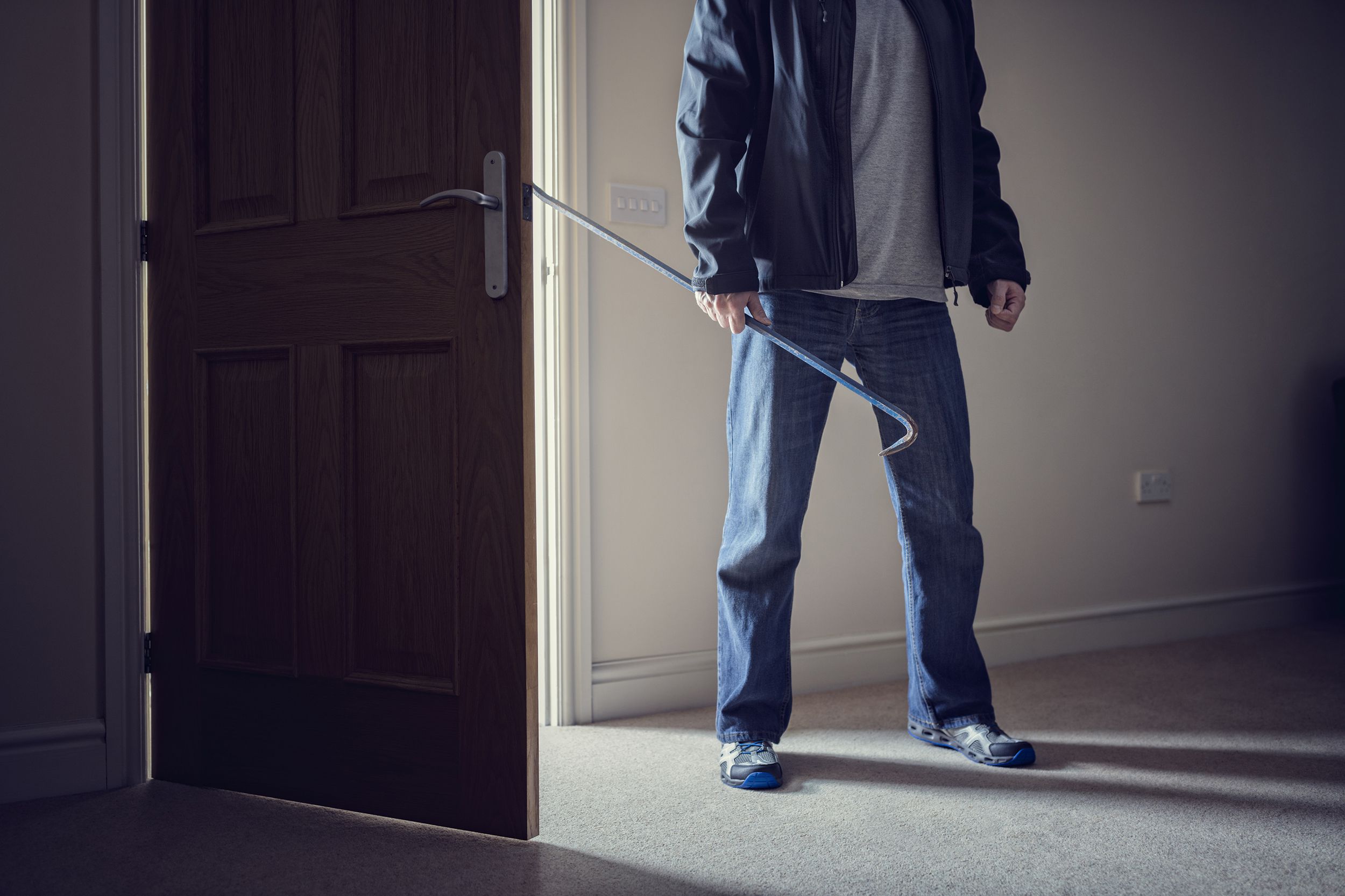 landlord standing in room with opened front door