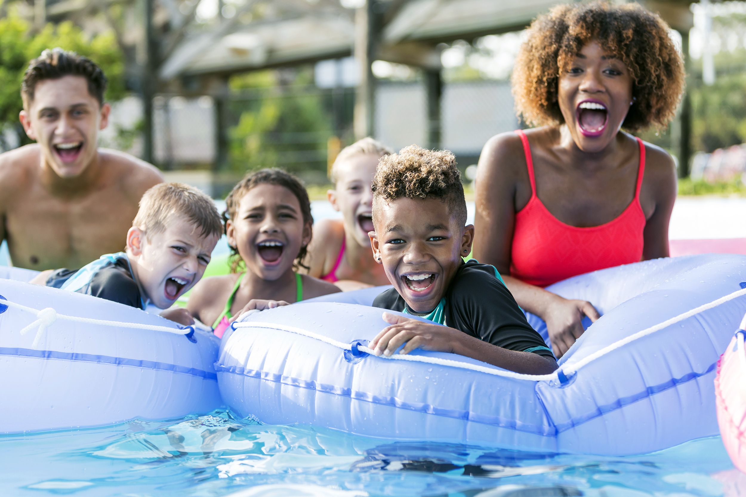 multi-ethnic children and young adults at water park