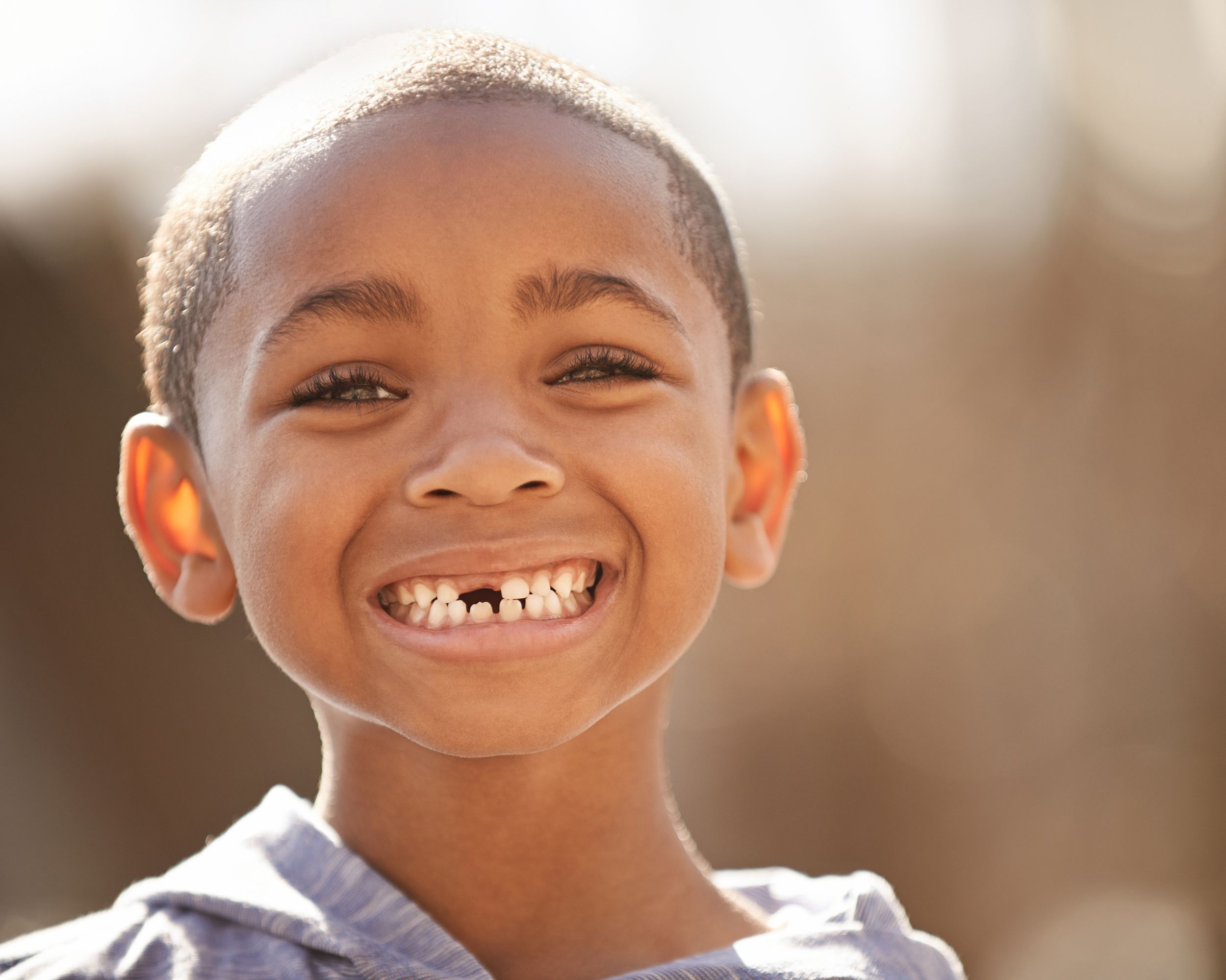 little African American boy with missing tooth