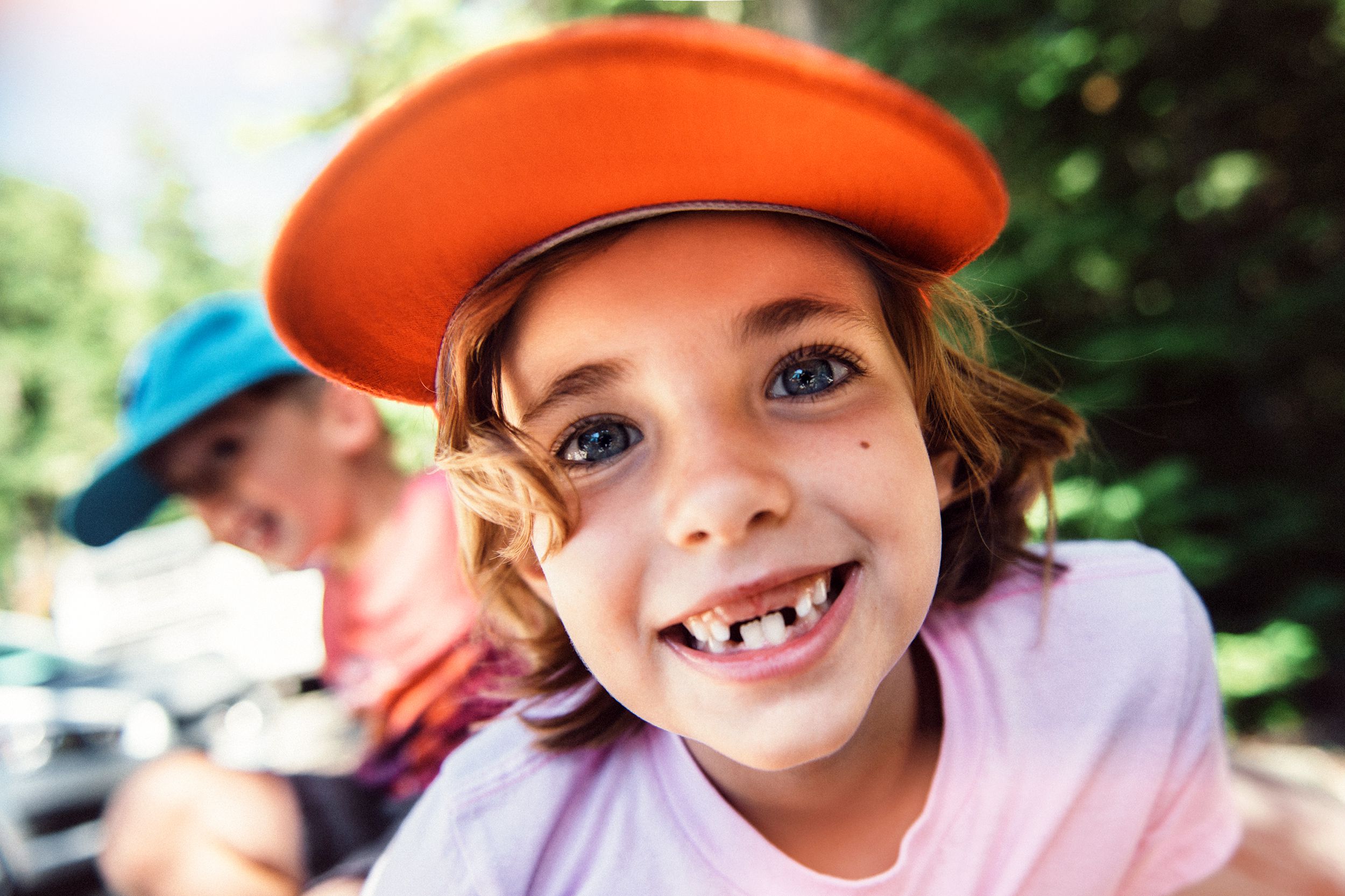 smiling little girl with missing teeth