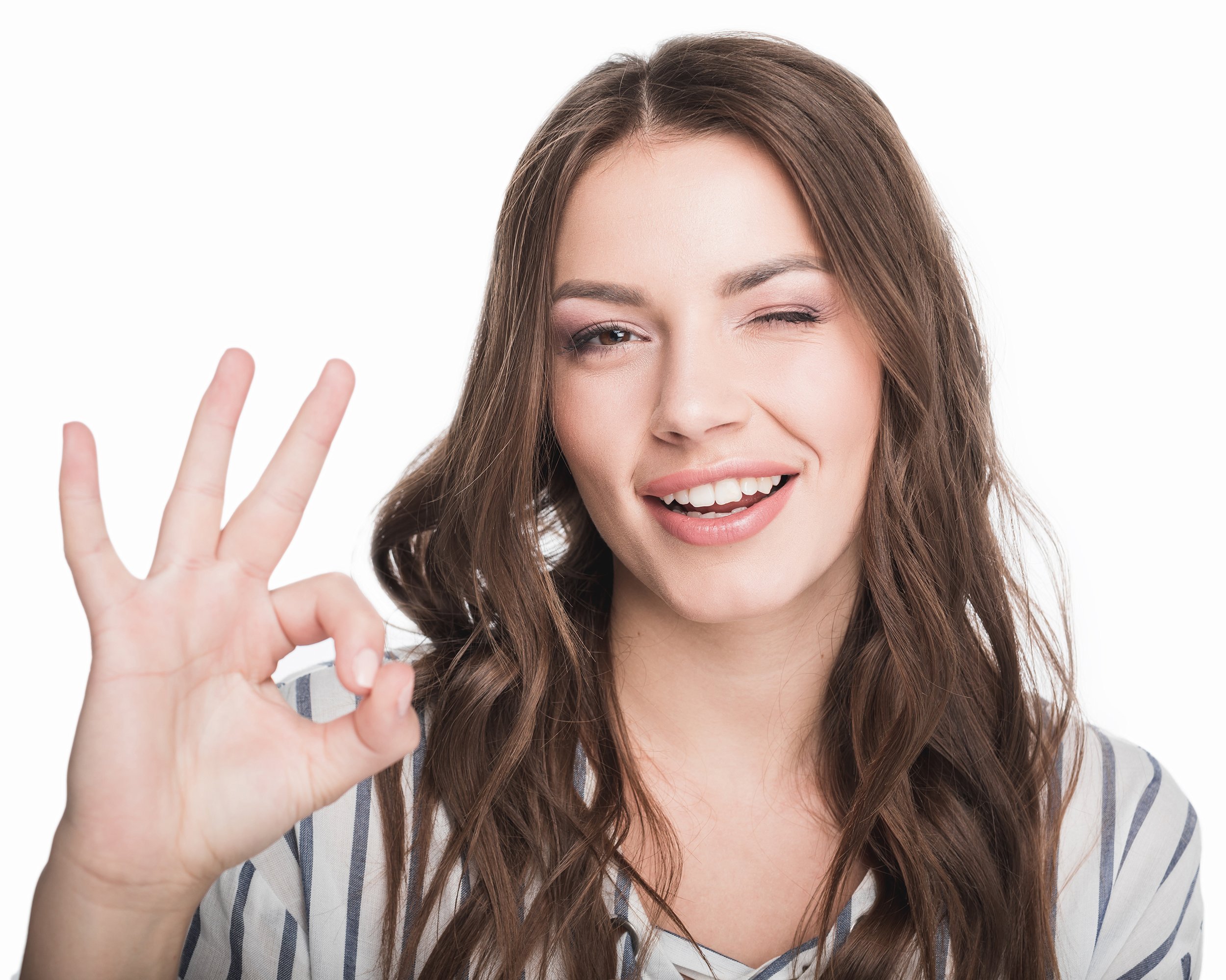 woman showing ok sign and looking at camera