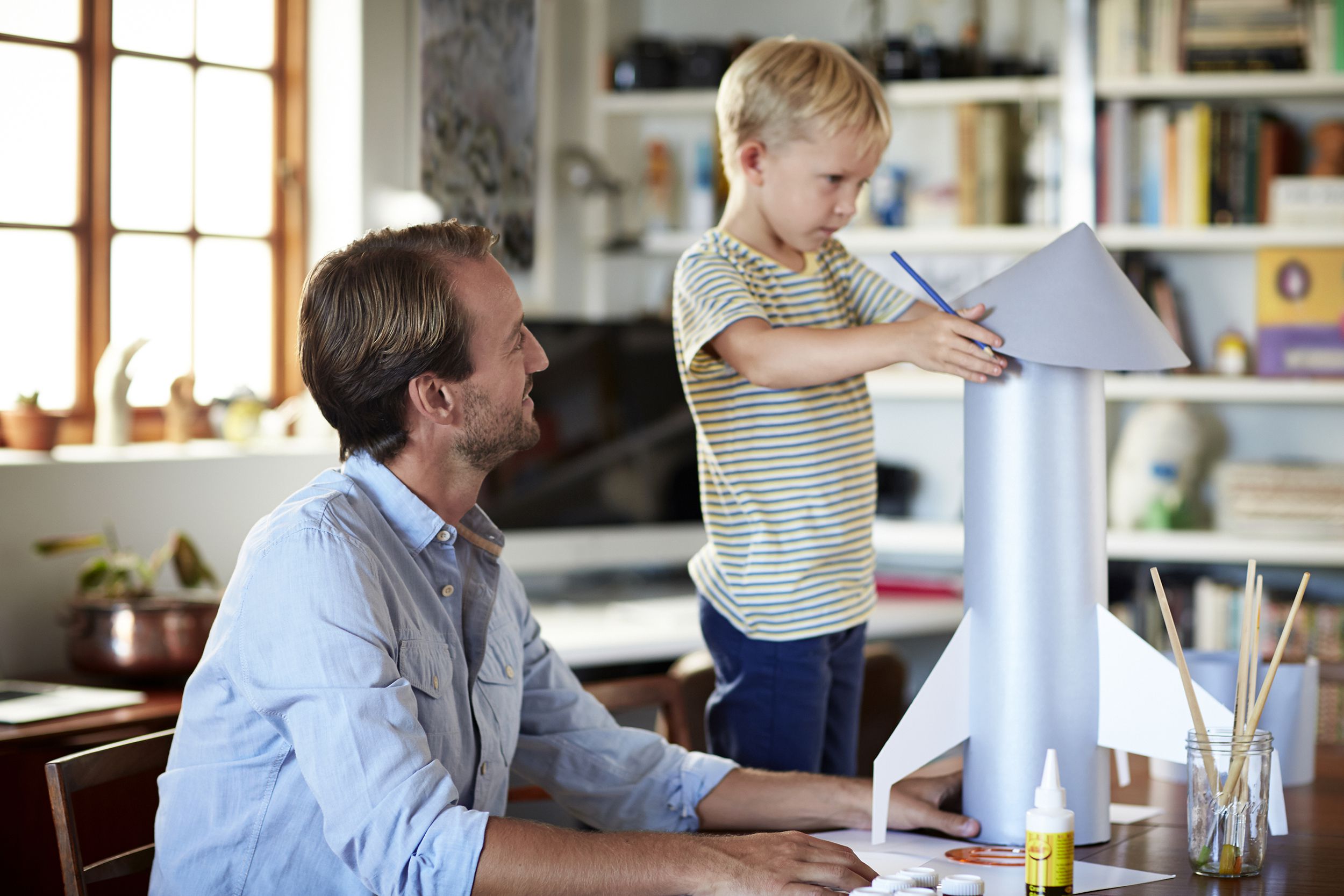 Father and son building a rocket