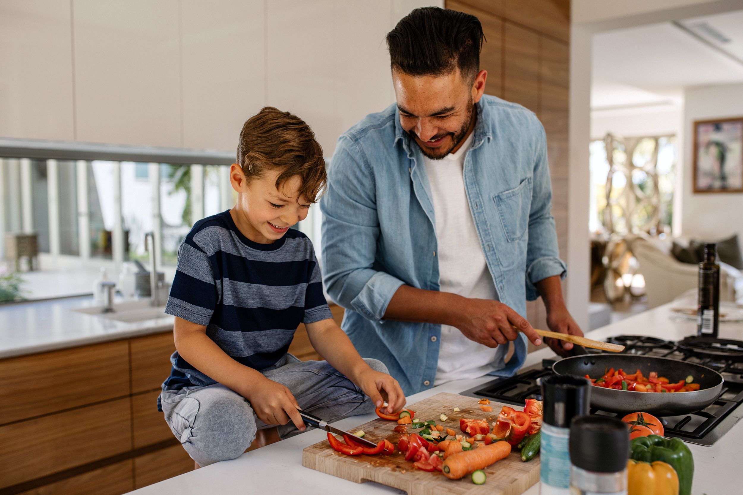 Father and son cooking in the kitchen