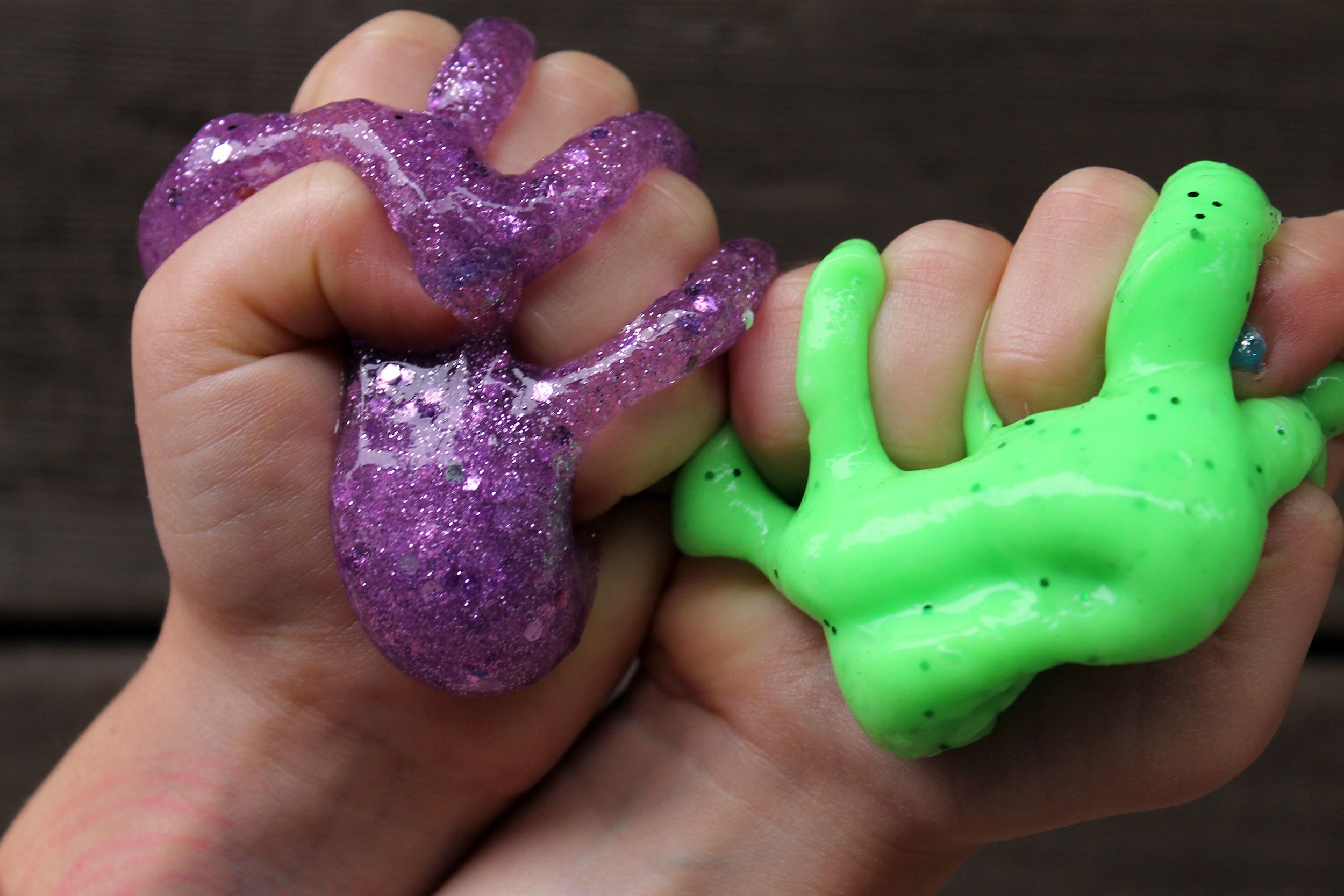 Kids hands holding slime