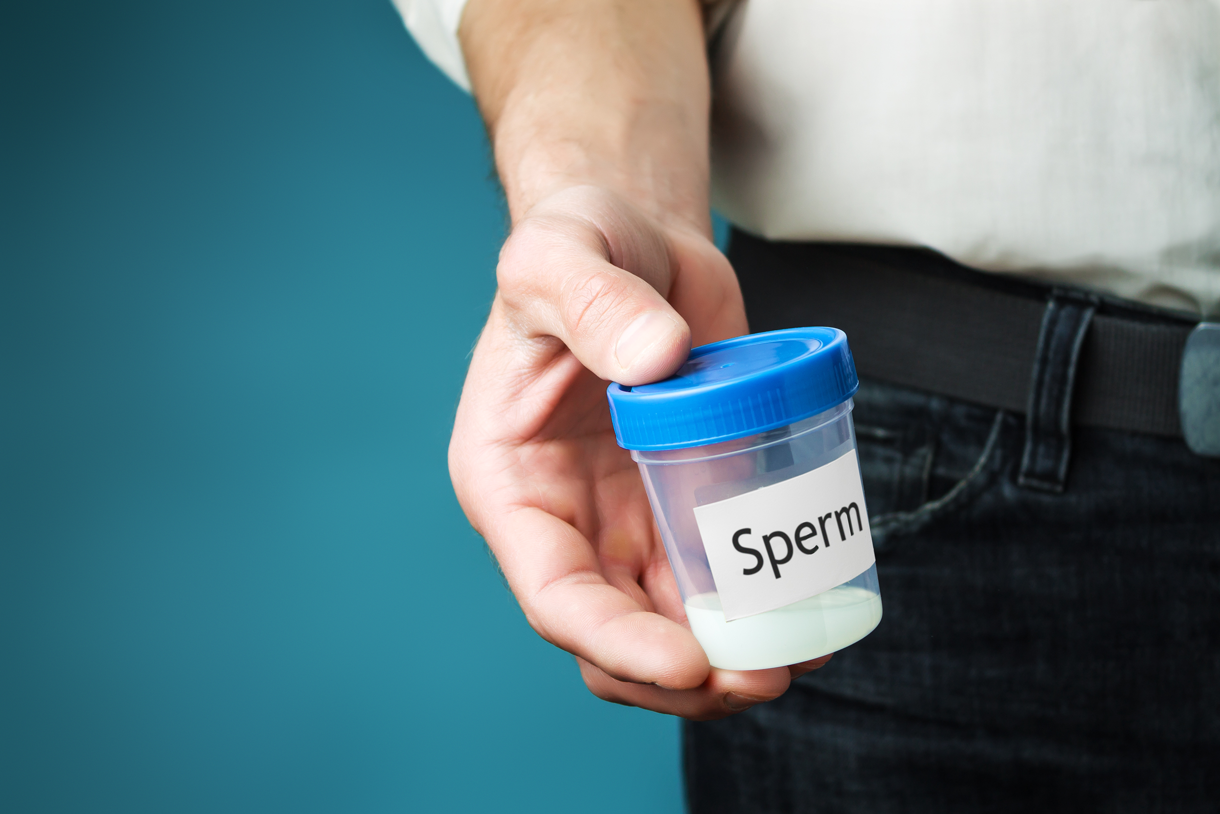 Man holding a sperm sample