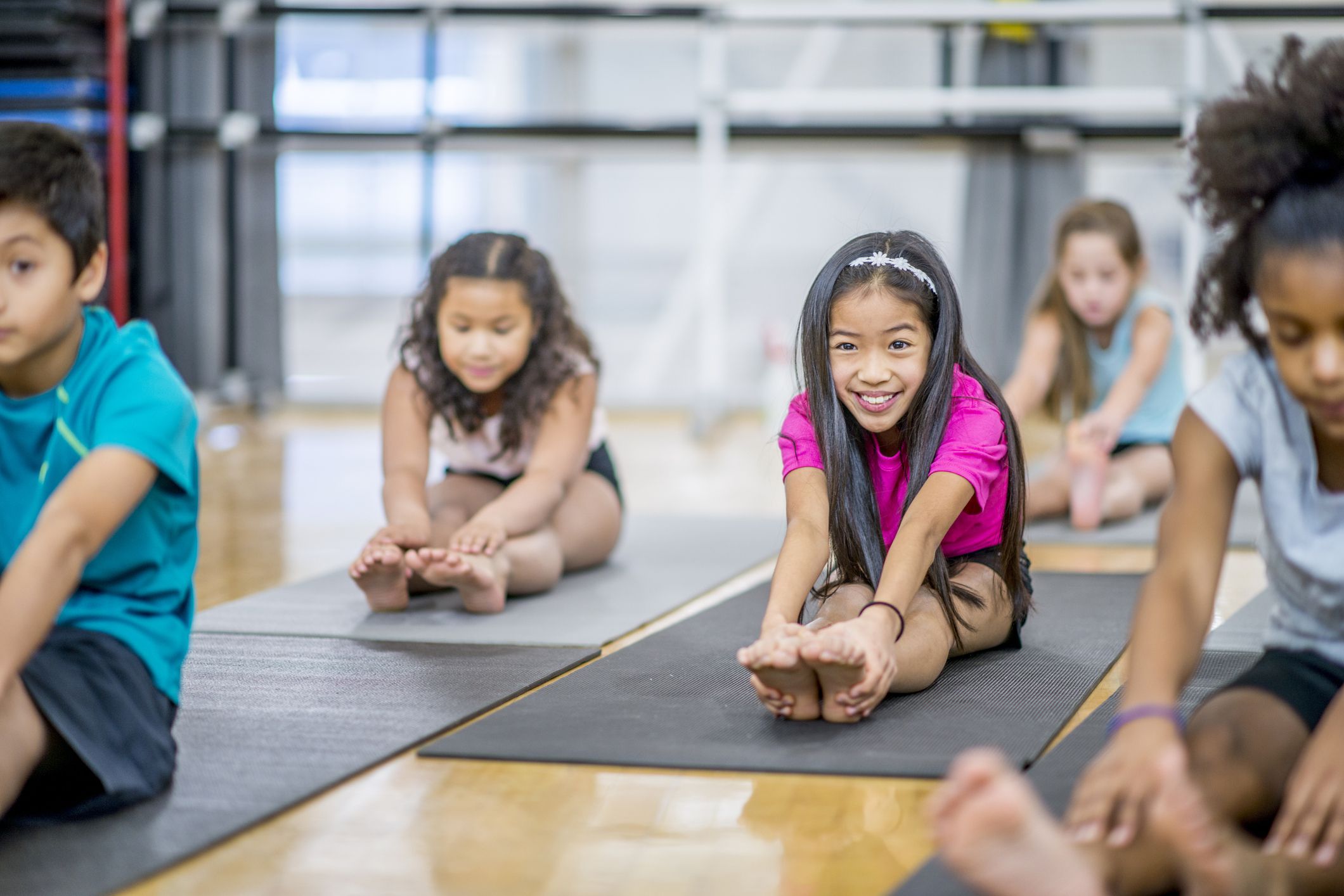 children happily doing yoga
