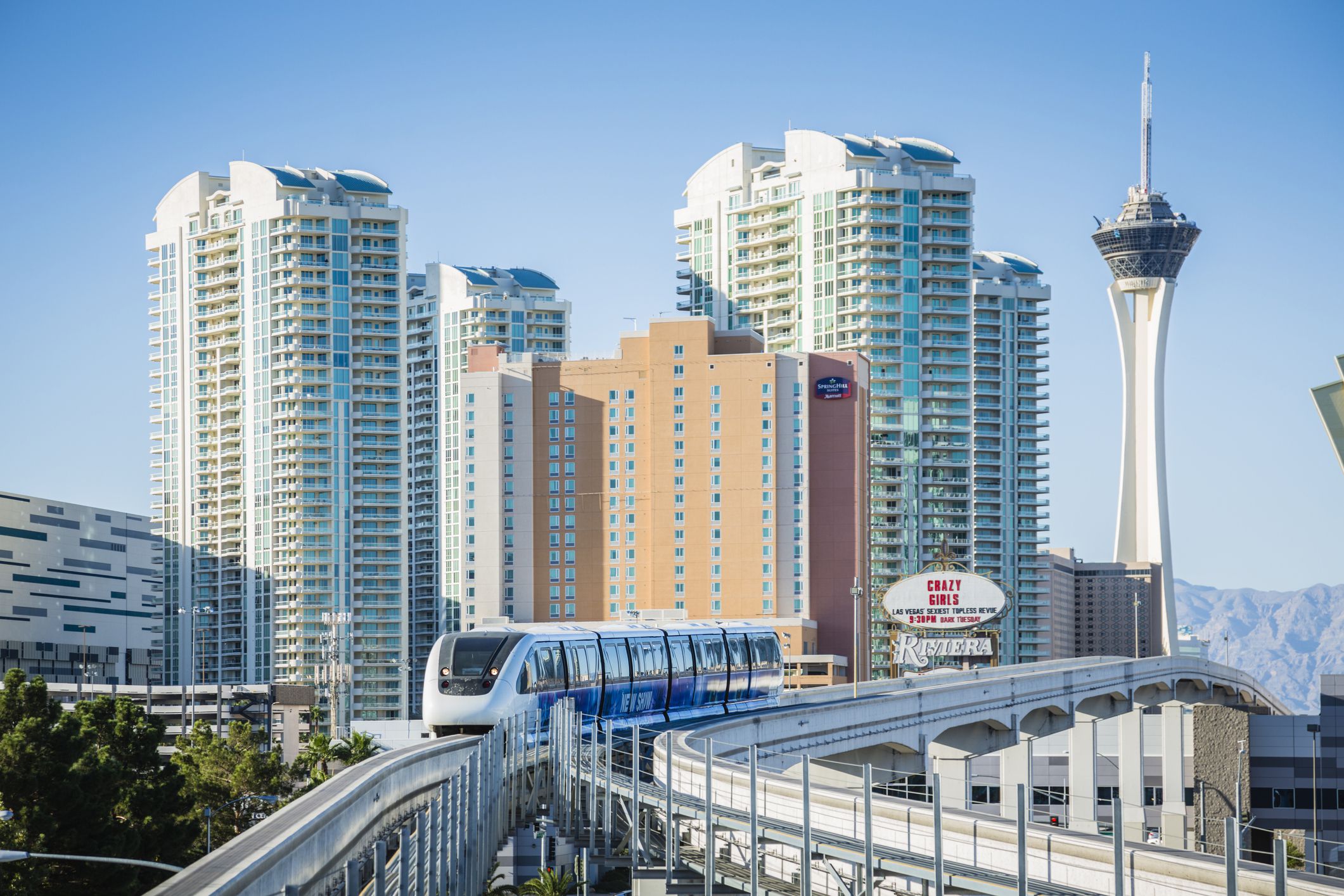 train on the las vegas monorail with a backdrop of resorts and casinos