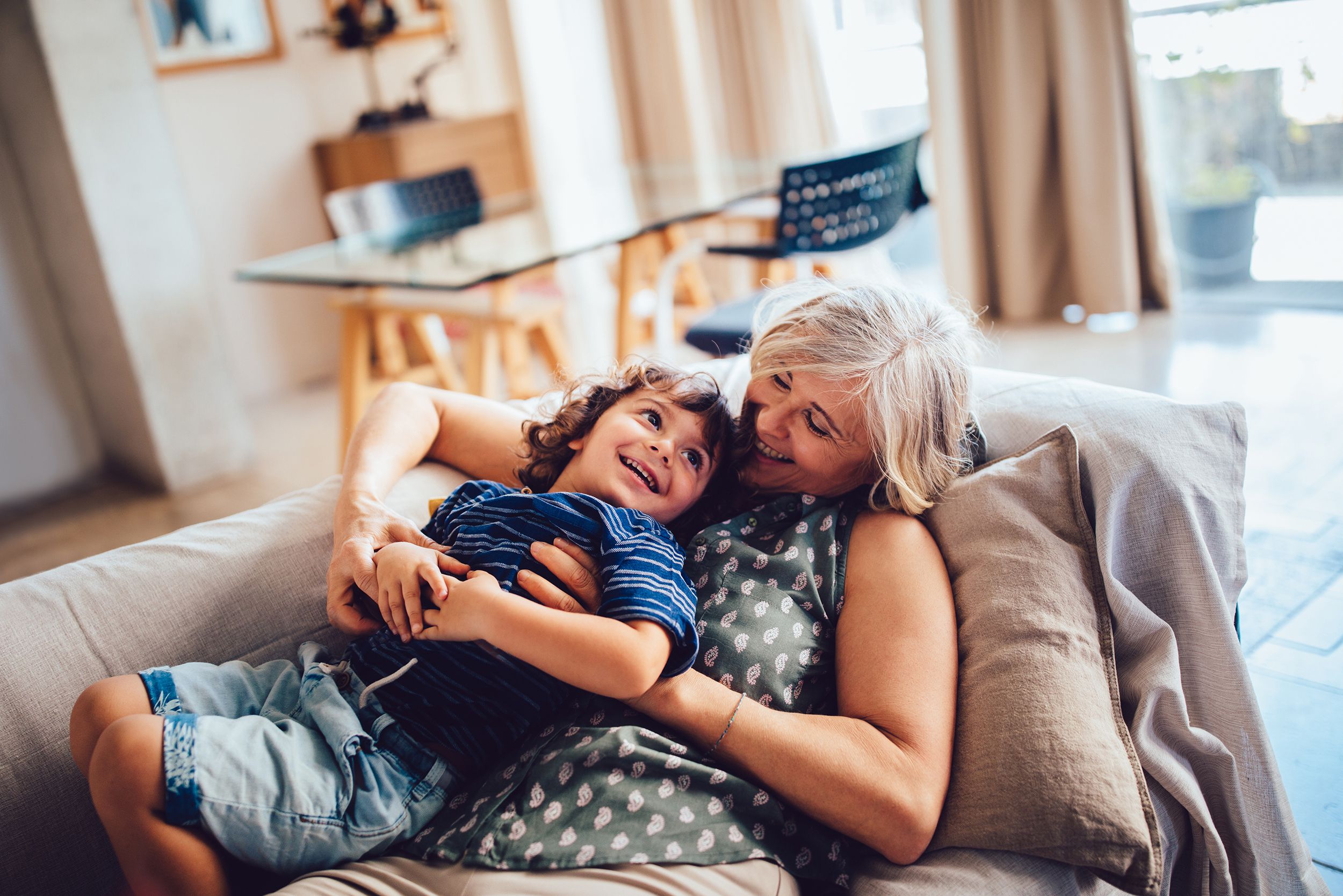 grandma and grandson playing together having fun at home