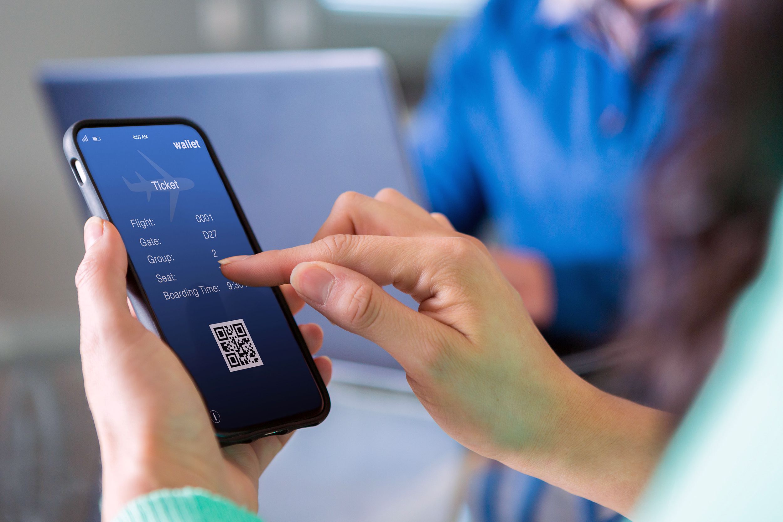 Woman buying an airplane ticket on her phone