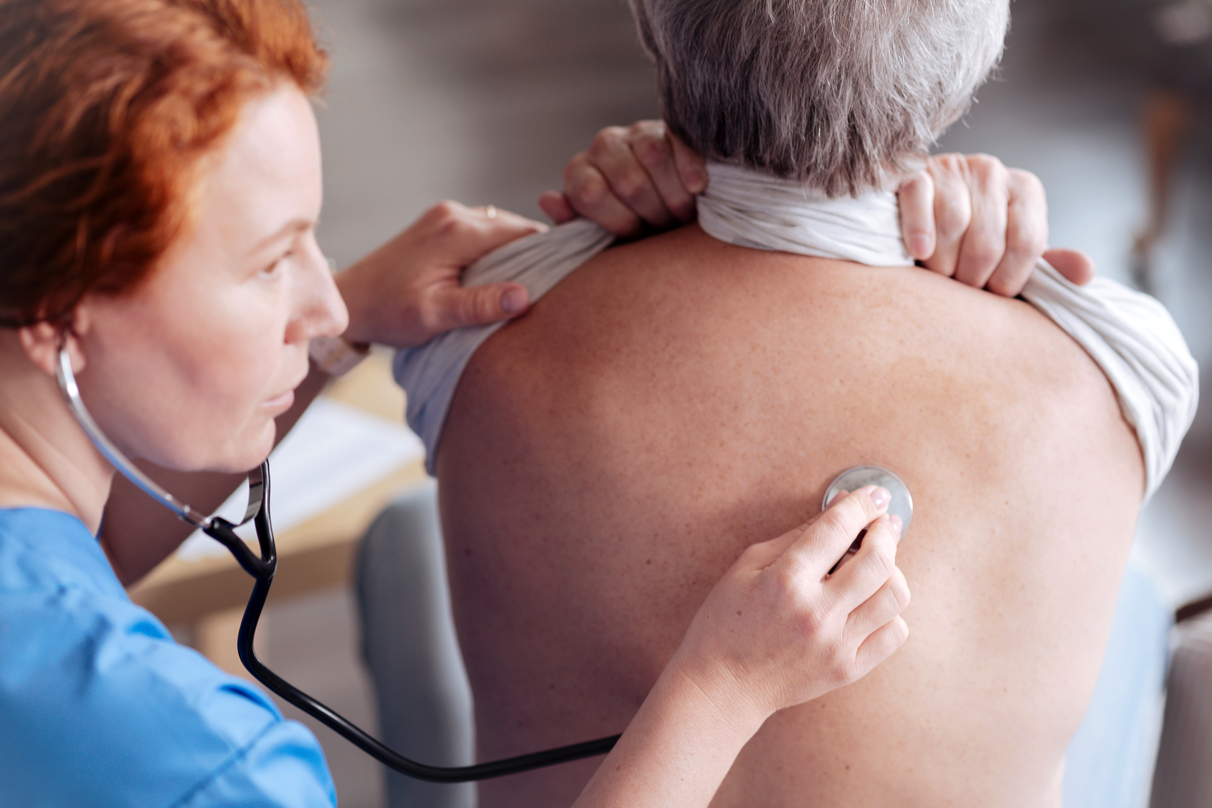 Woman getting her lungs checked at the doctor