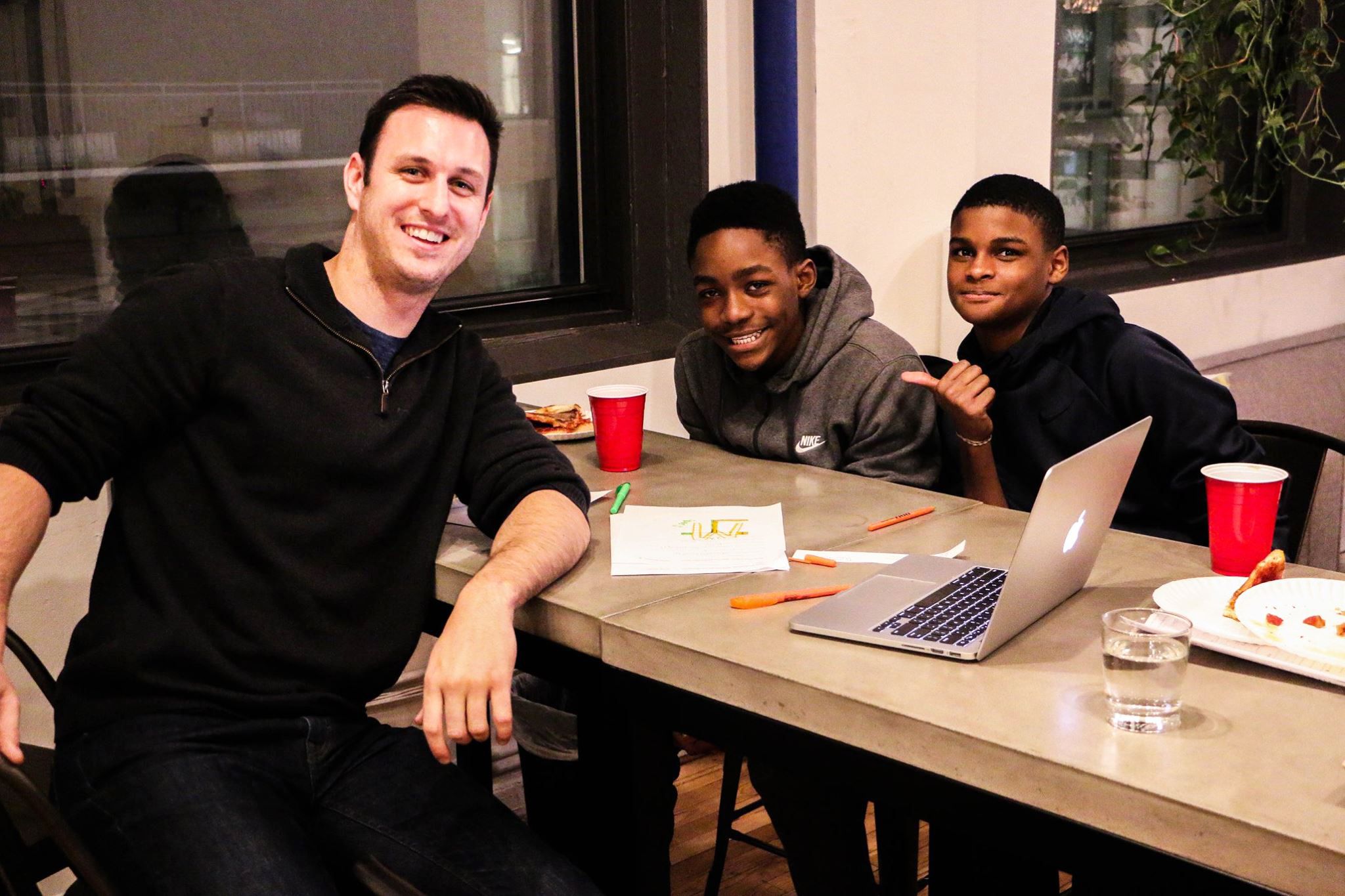 SquareFoot employee with two young students