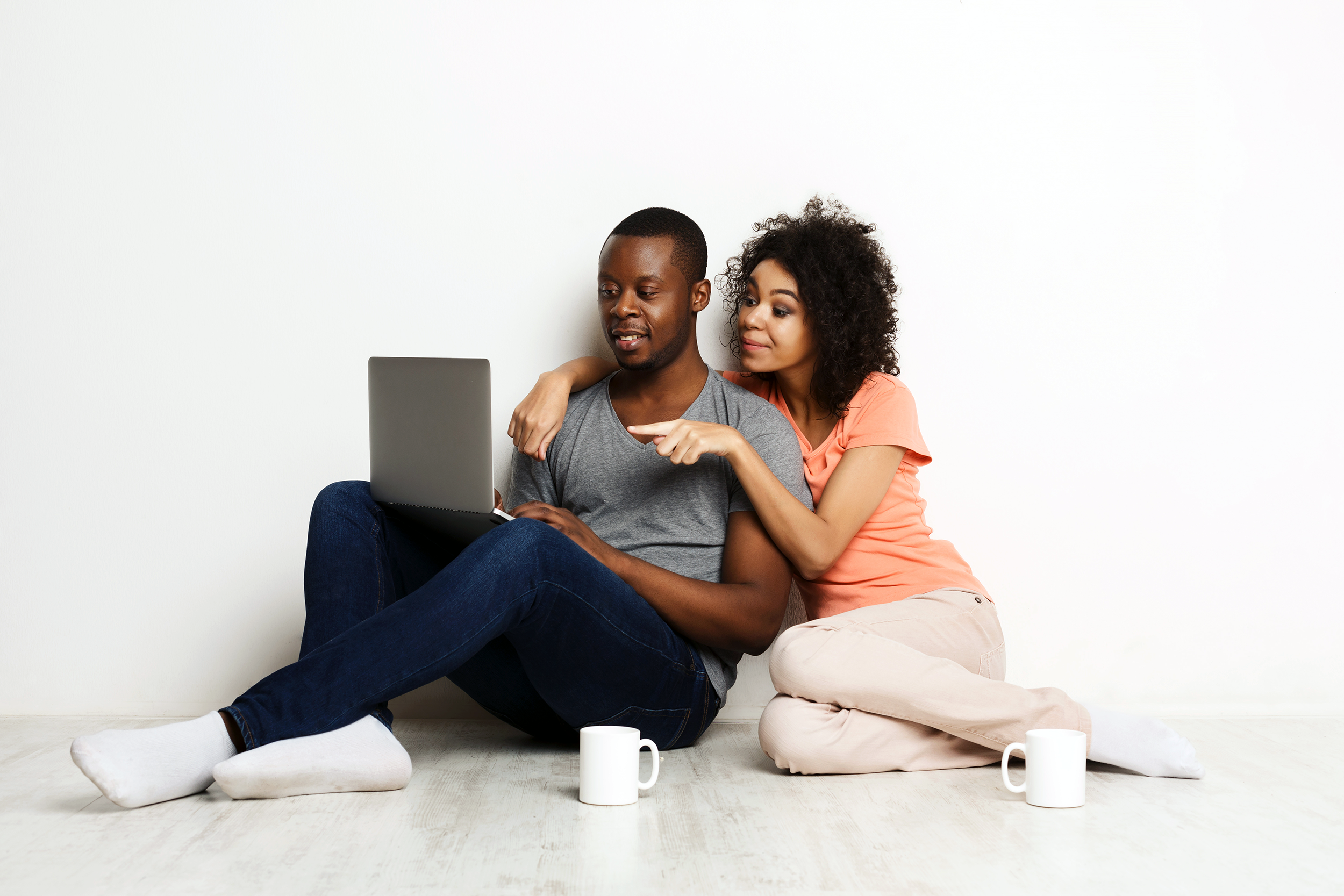 Couple looking at new houses online