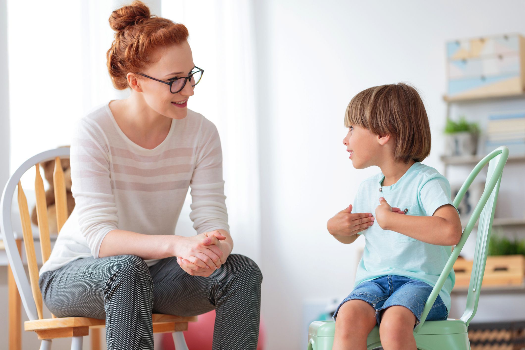 young child talking to psychotherapist