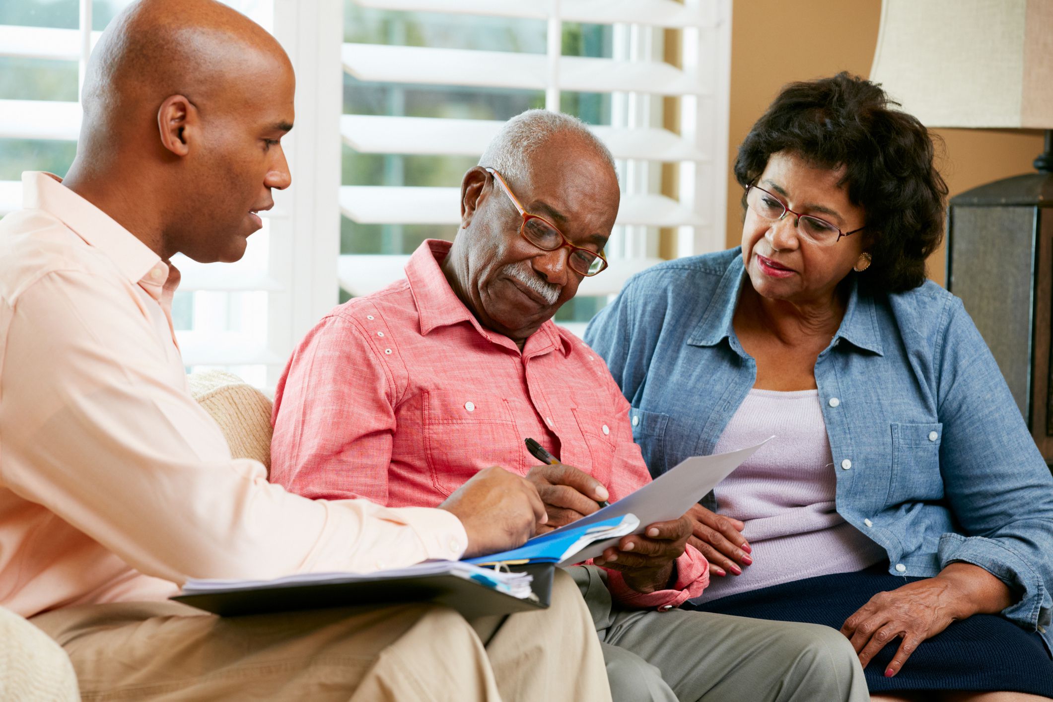 couple meeting with insurance agent