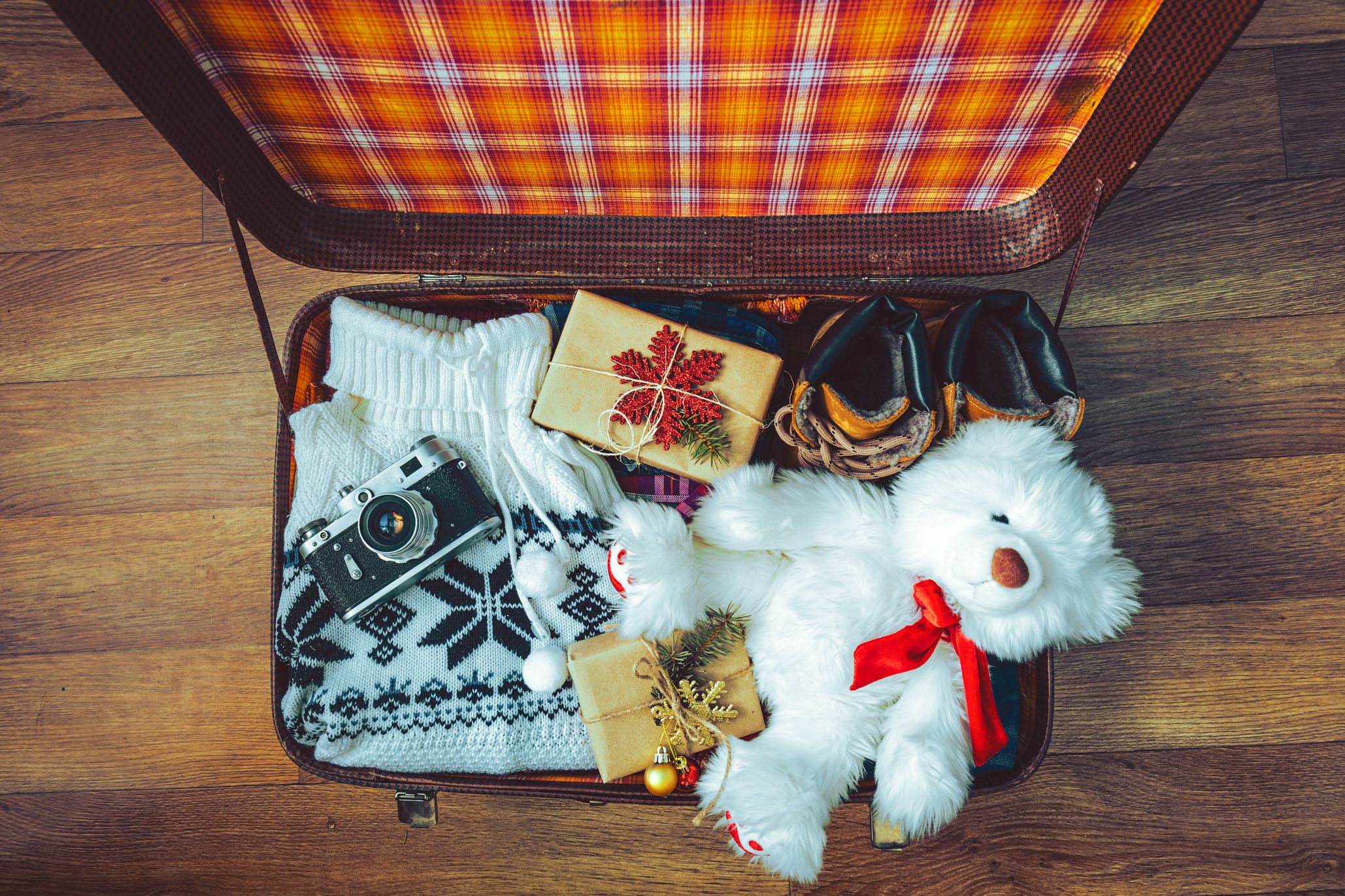 open carry-on suitcase with small gifts