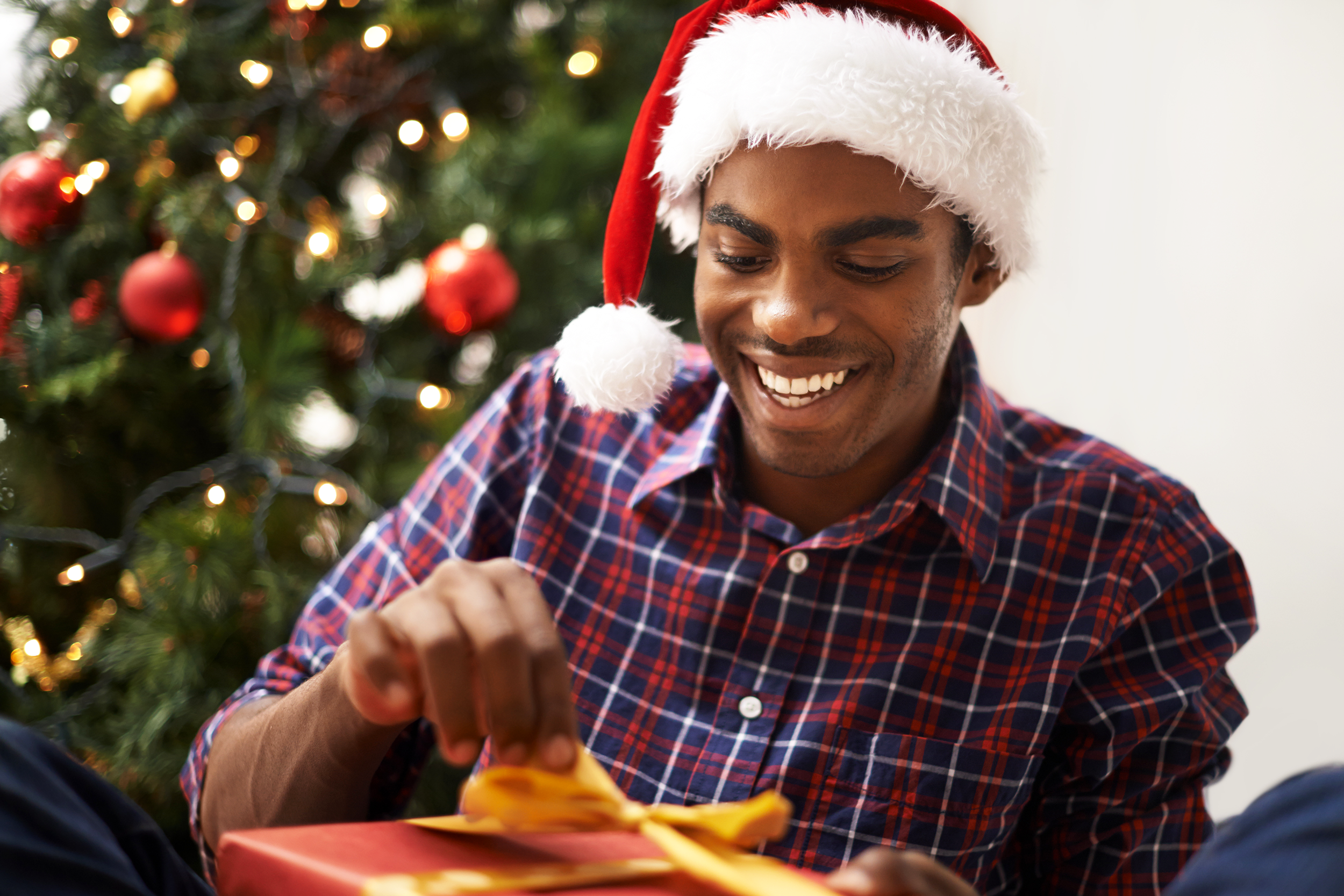 Man opening Christmas present