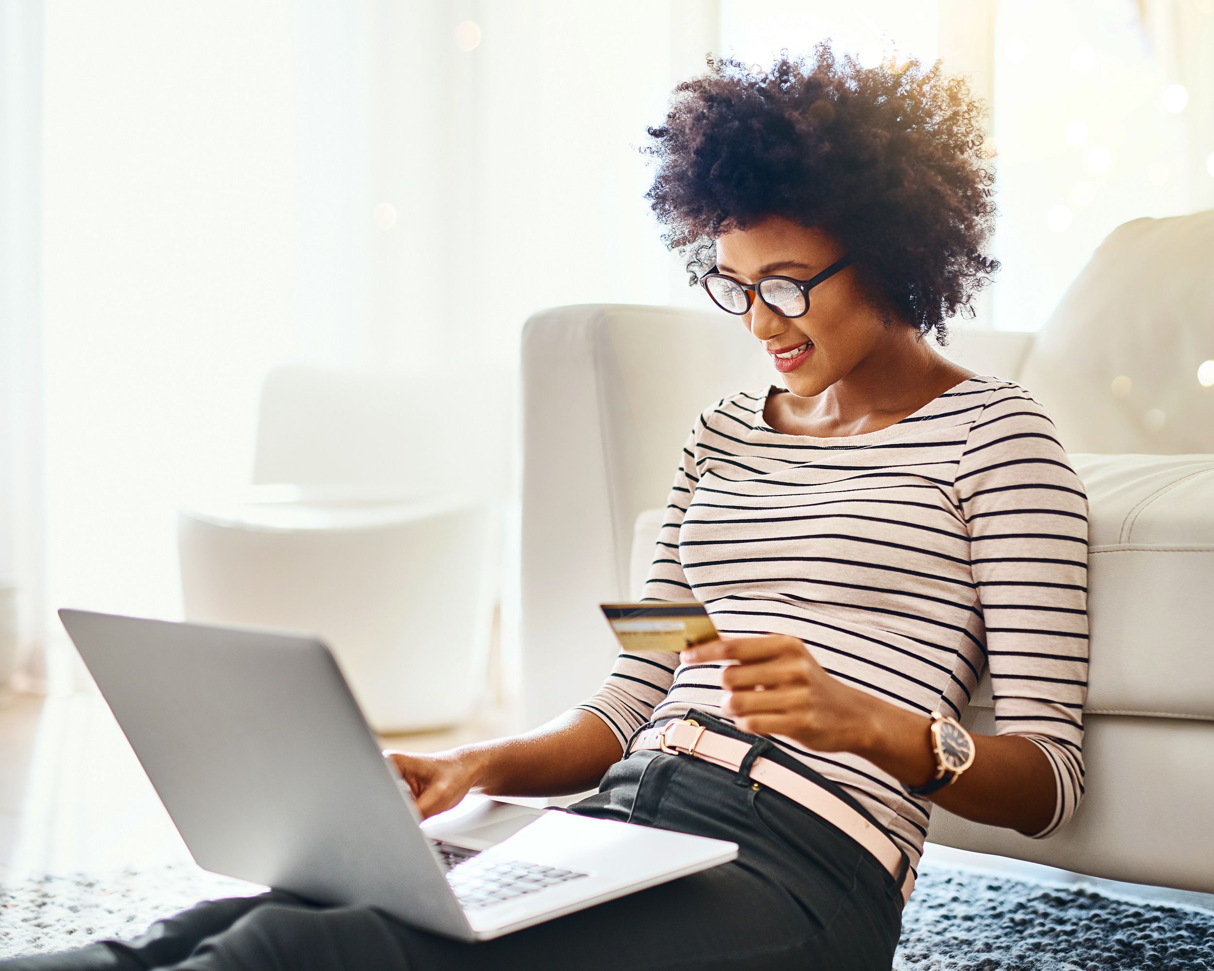 mixed-race woman shopping on laptop
