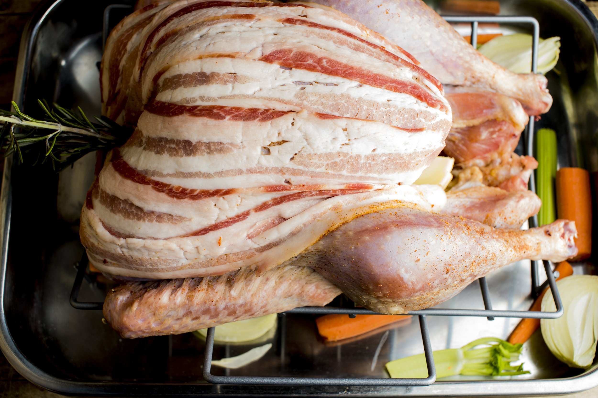 Turkey with bacon strips wrapped around the breast