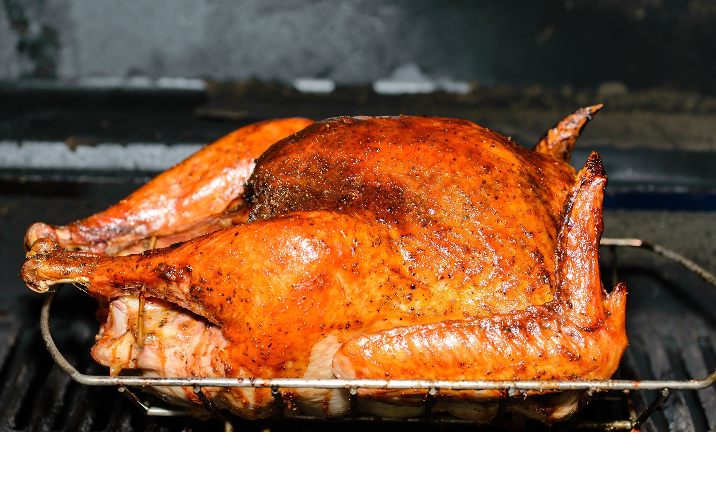 Turkey rubbed in barbecue seasonings and cooked on grill