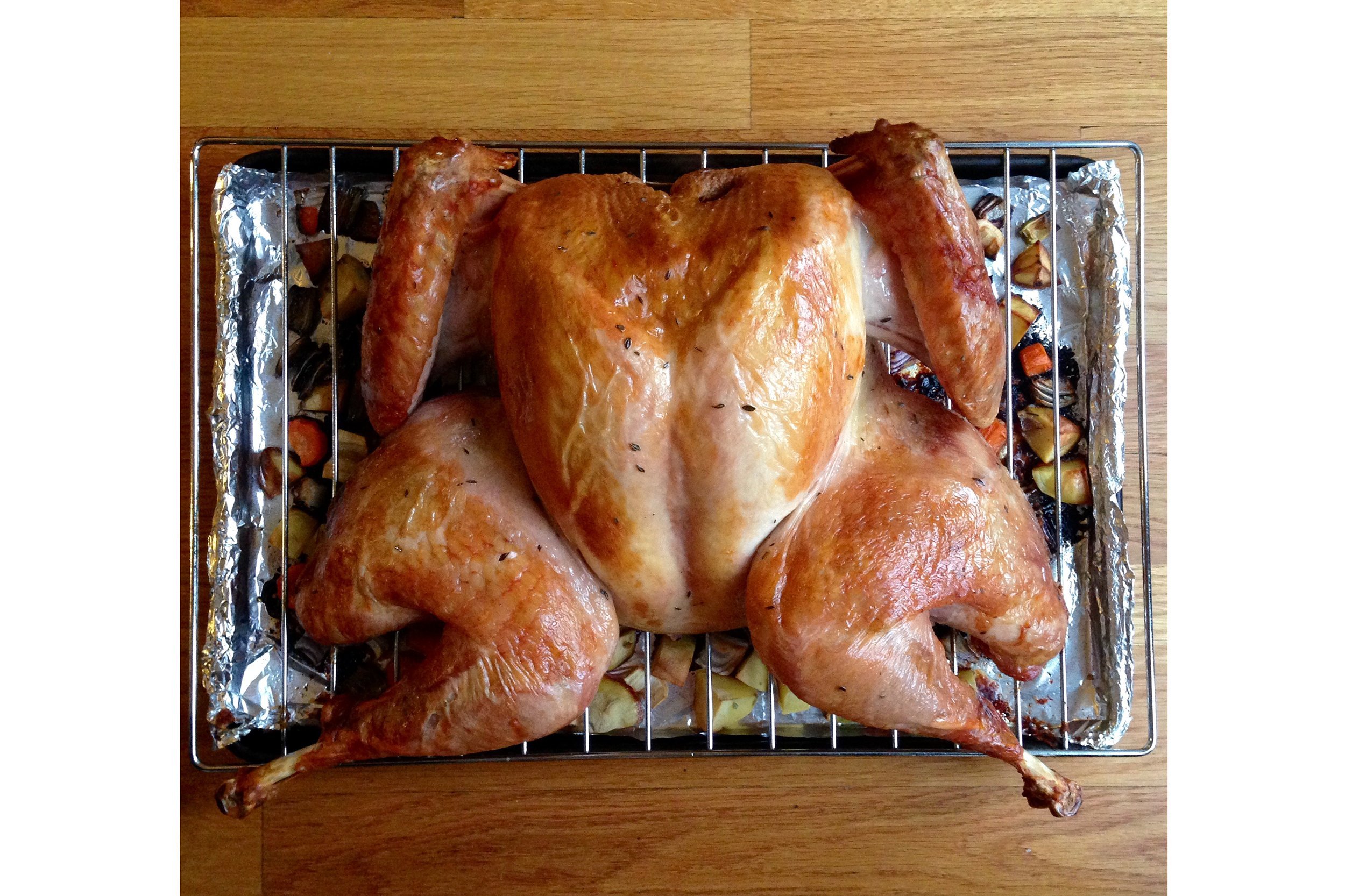 Spatchcocked turkey on a grill