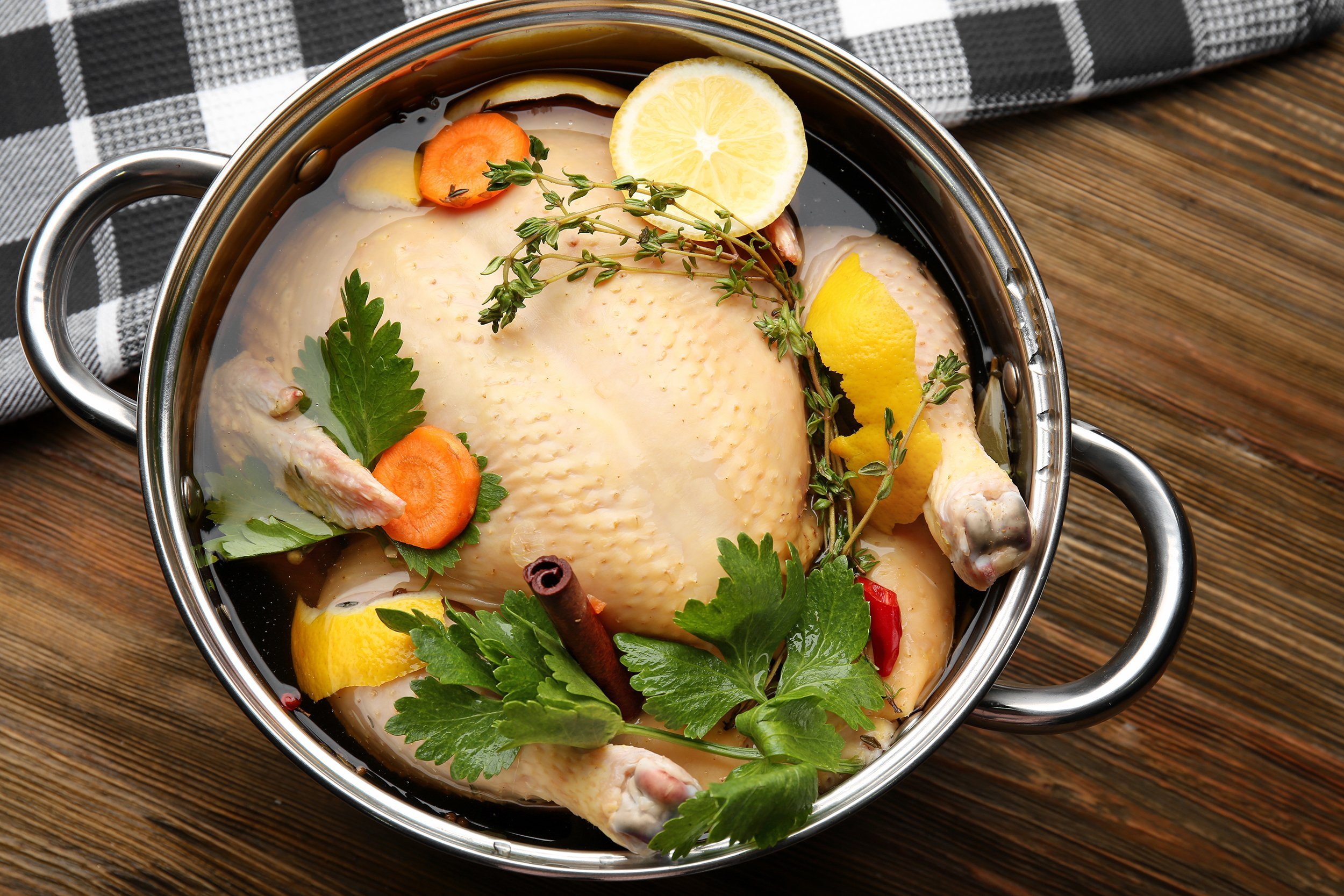 Turkey brining in a pot with aromatics