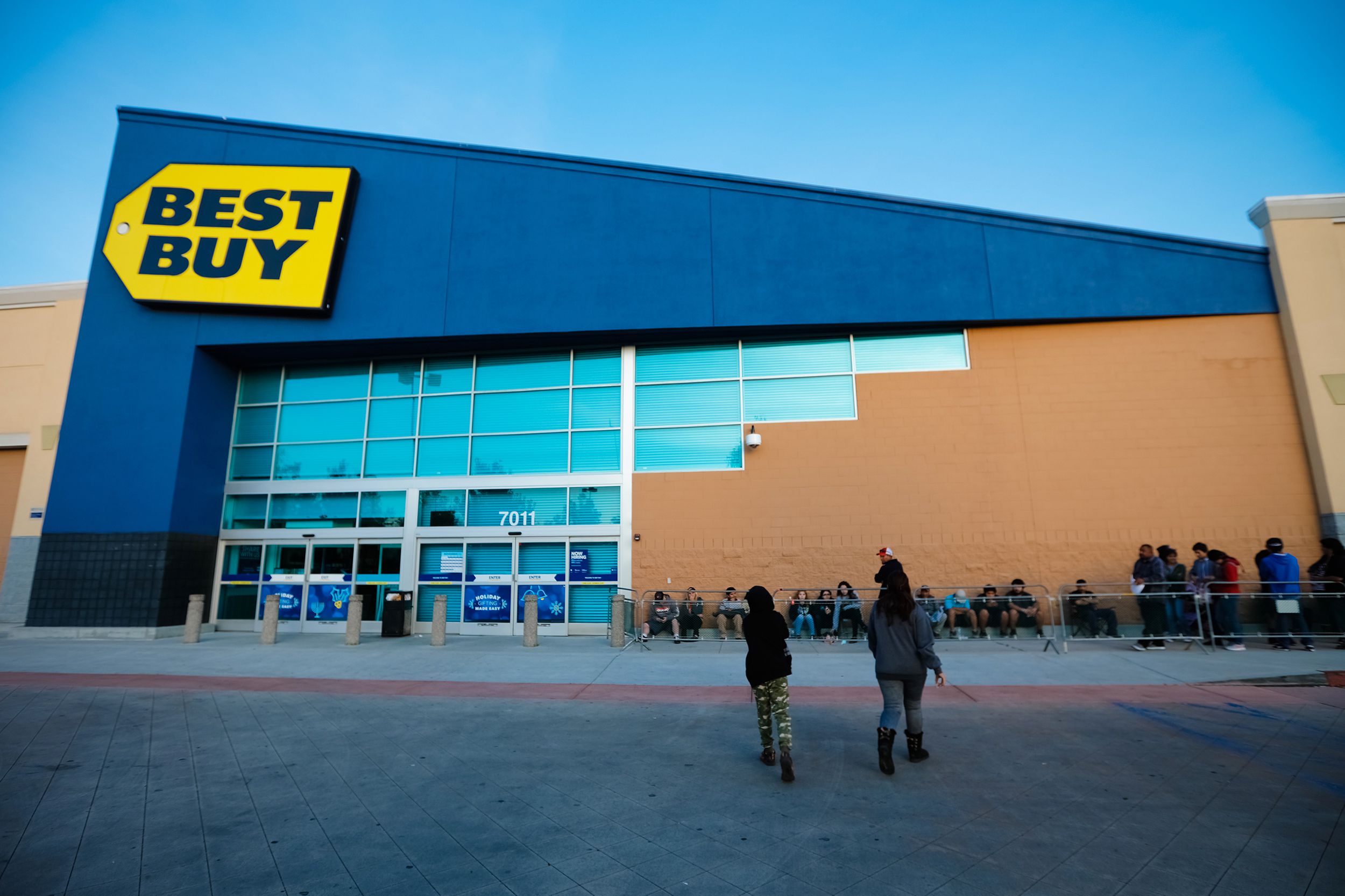 shoppers await the lines on Black Friday sales at Best Buy
