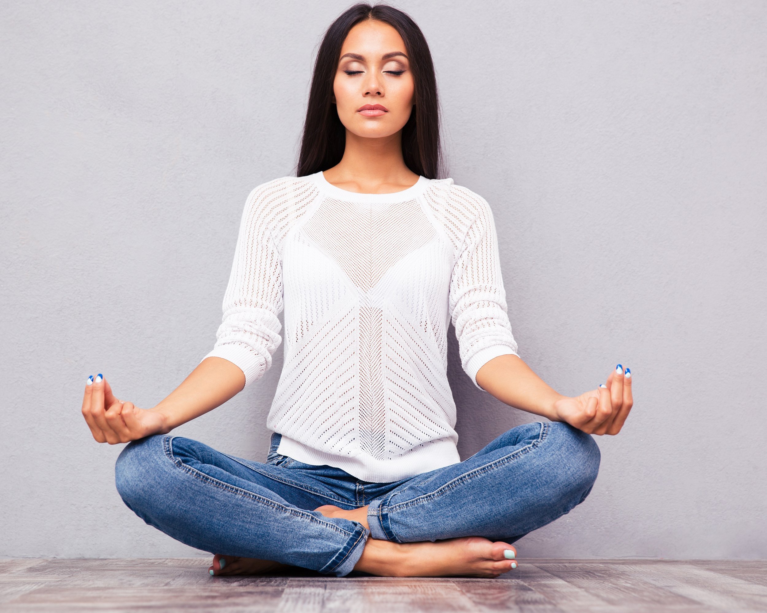 woman meditating on the floor
