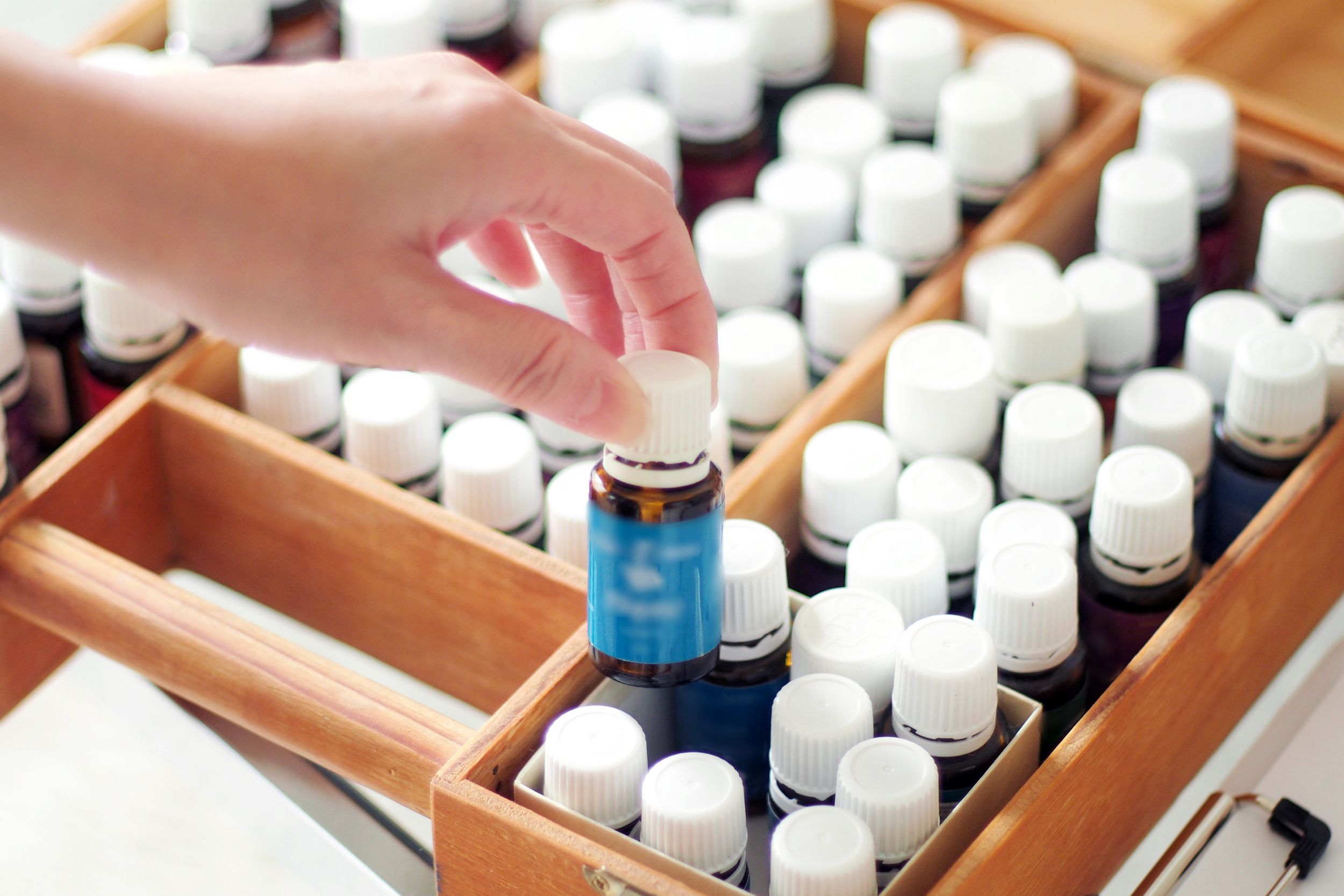 woman choosing essential oil