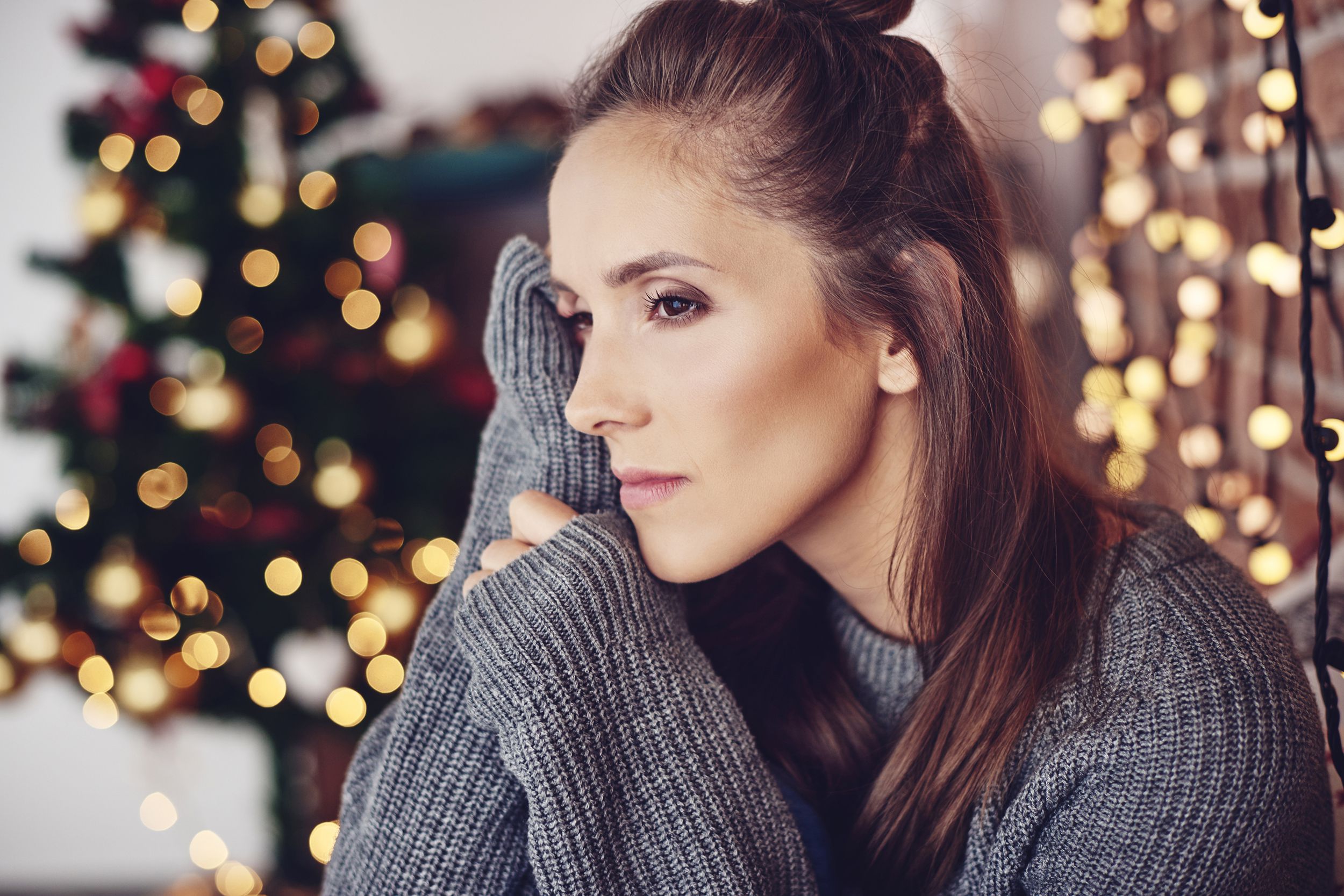 woman thinking and worrying at home during the holidays