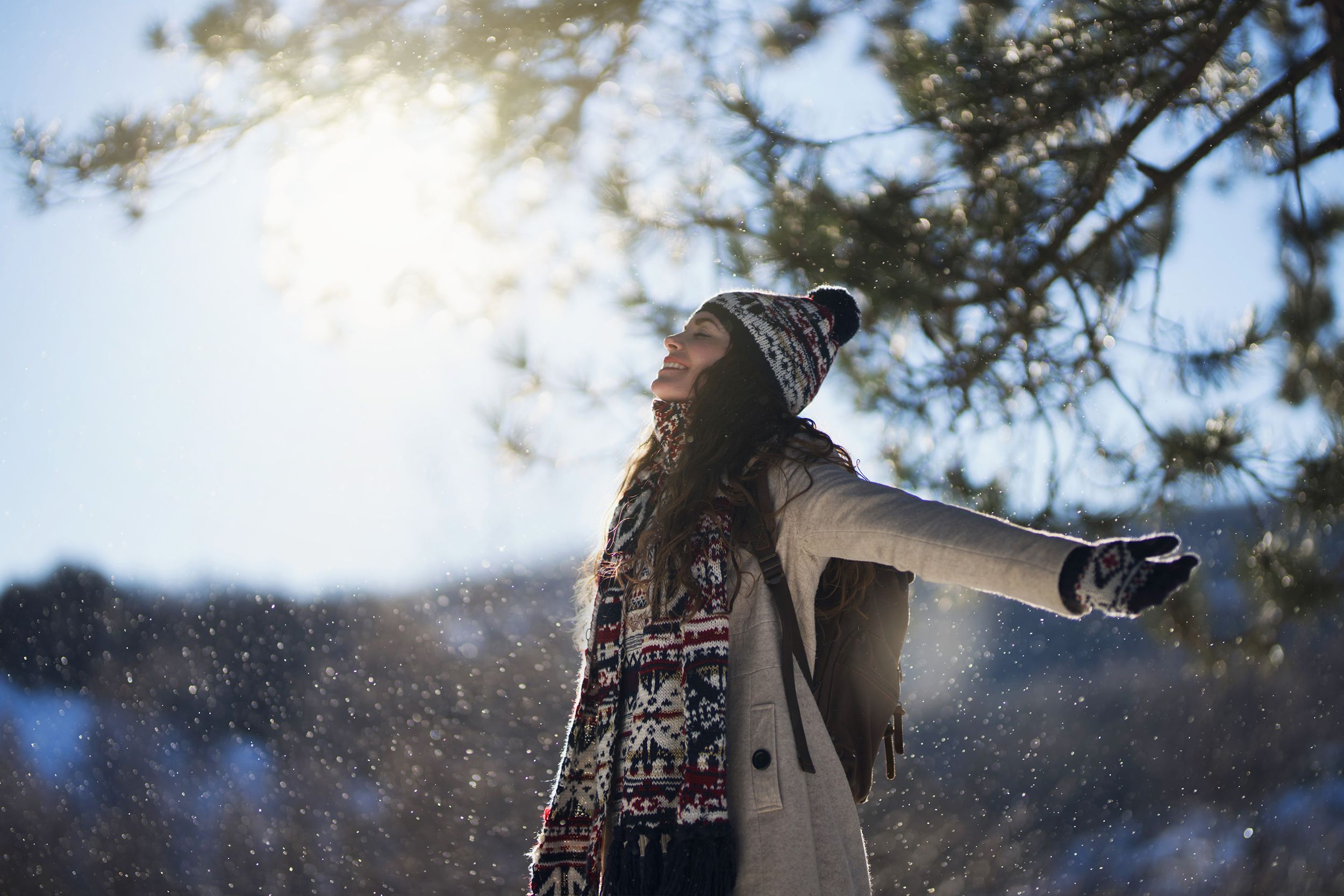 woman outside breathing in the winter