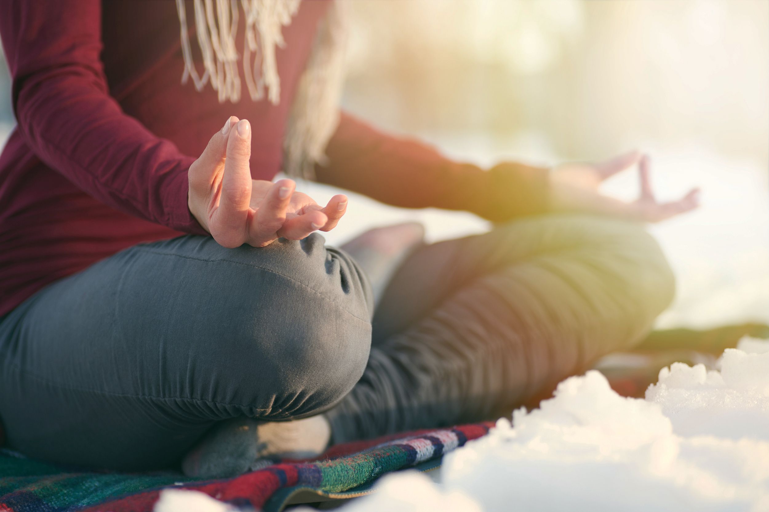 woman doing yoga in nature at winter