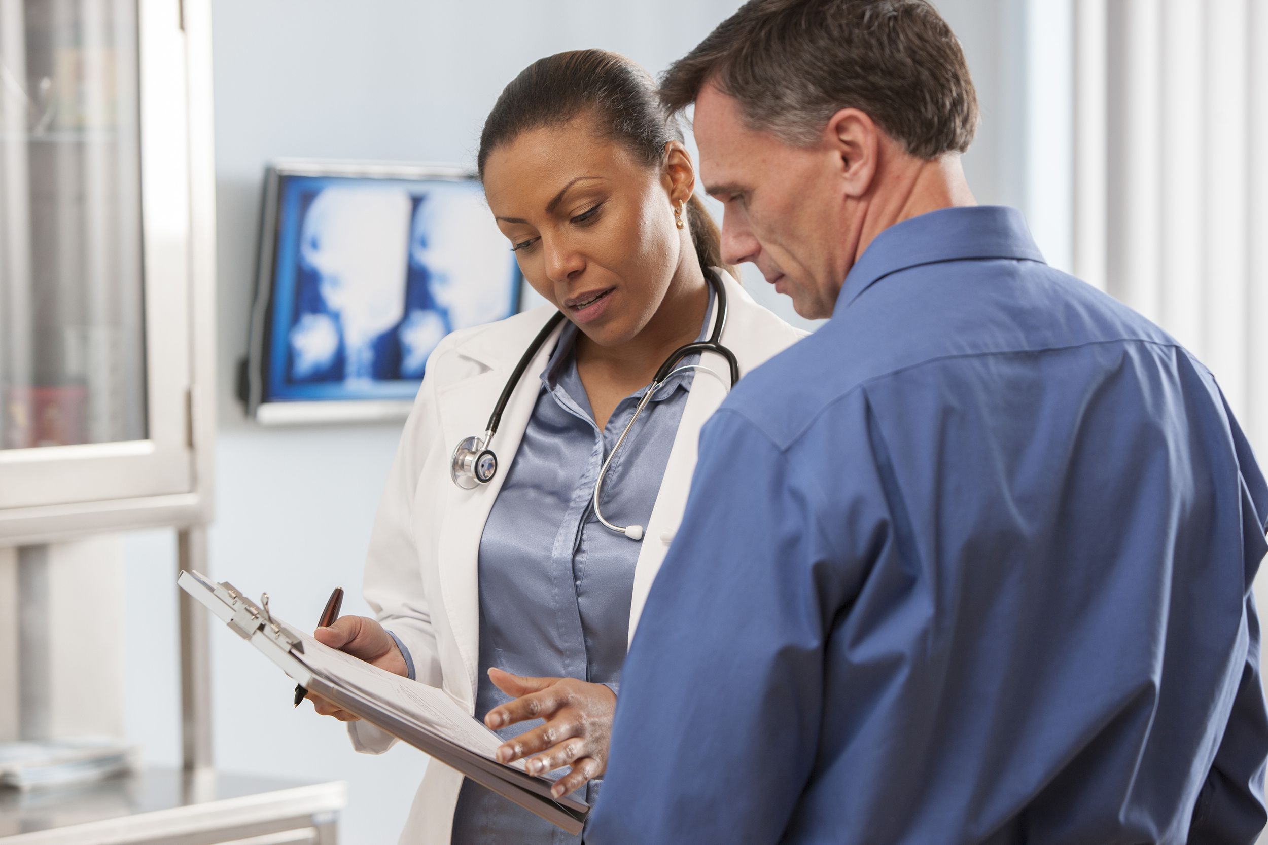 female doctor talking with patient