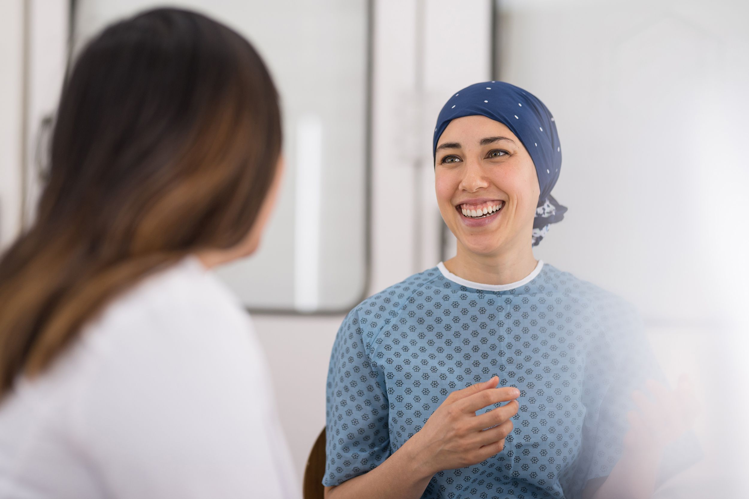 young female cancer patient meets with her doctor