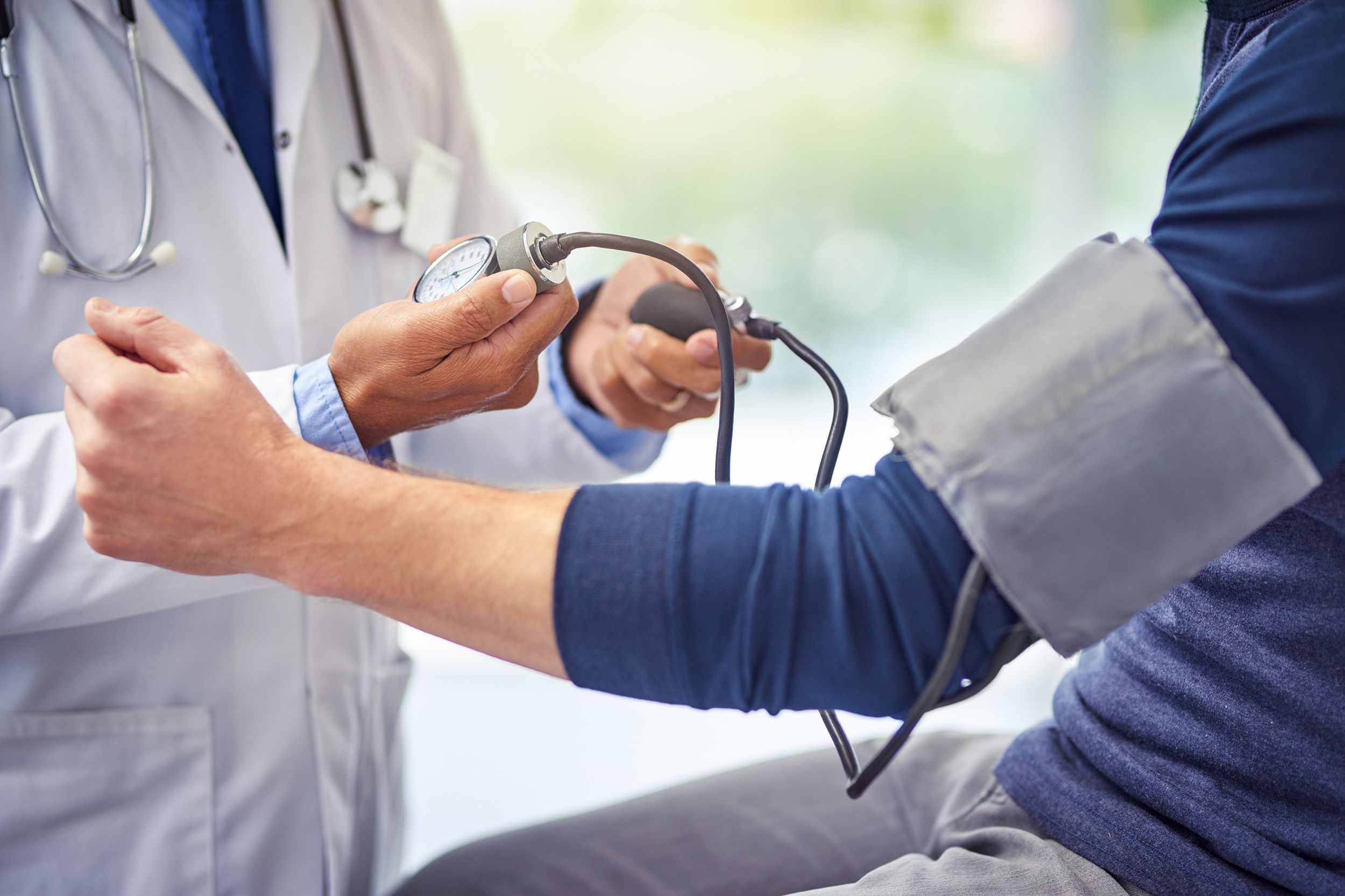 man getting heart checked out by doctor