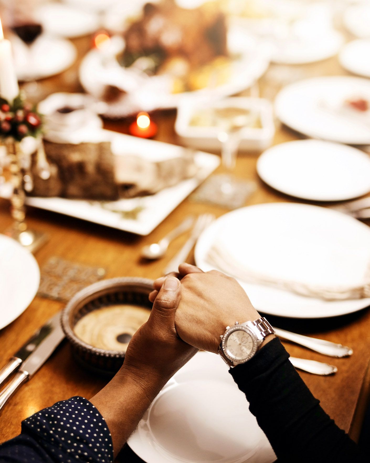 hands together at holiday dinner