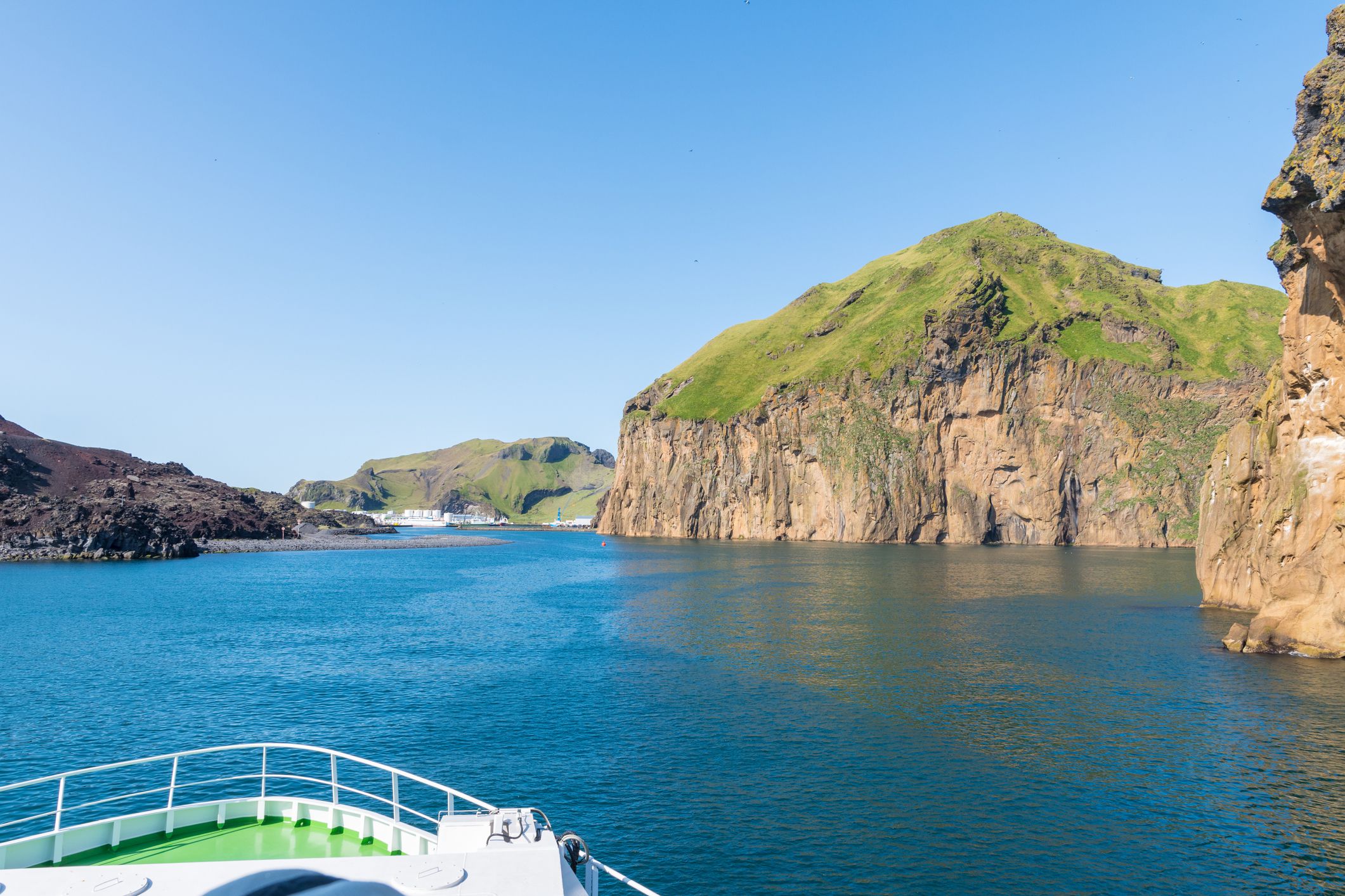 Ferry entering Port of island of Heimaey in Vestmannaeyjar of the south coast of Iceland
